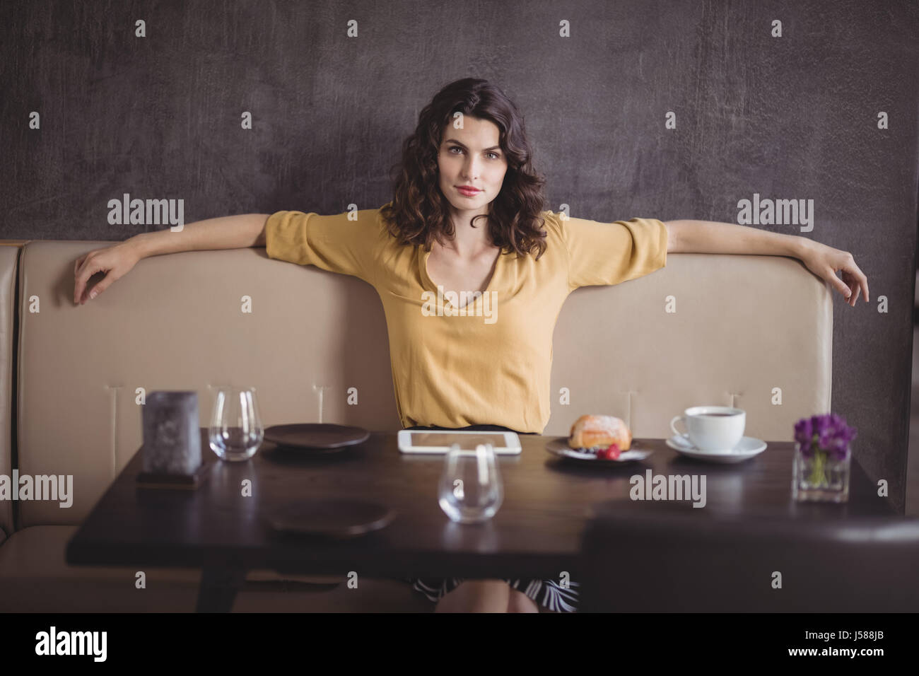 Portrait of beautiful woman sitting in restaurant Stock Photo - Alamy