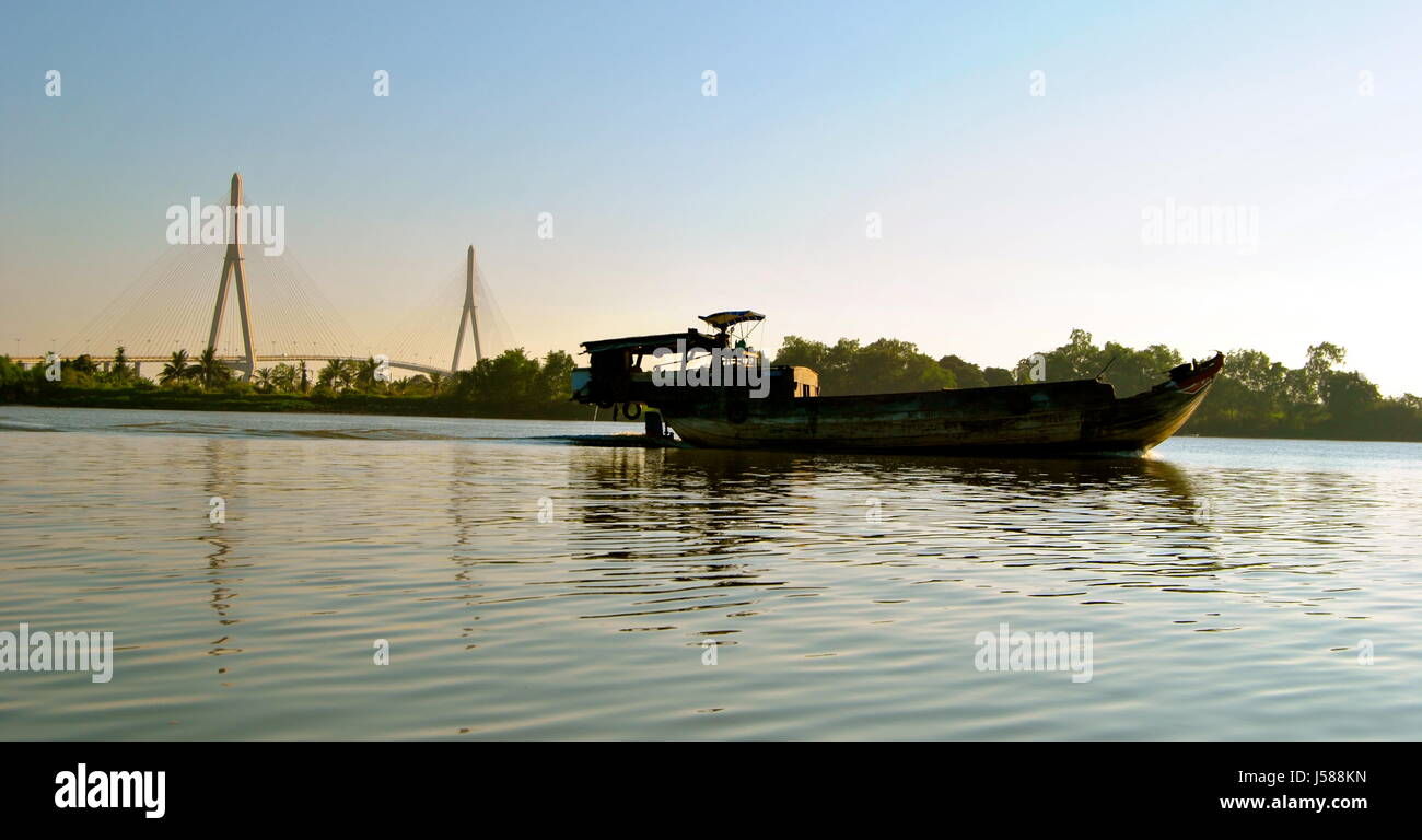 A boat, in front of the Can Tho bridge, Can Tho, Vietnam Stock Photo