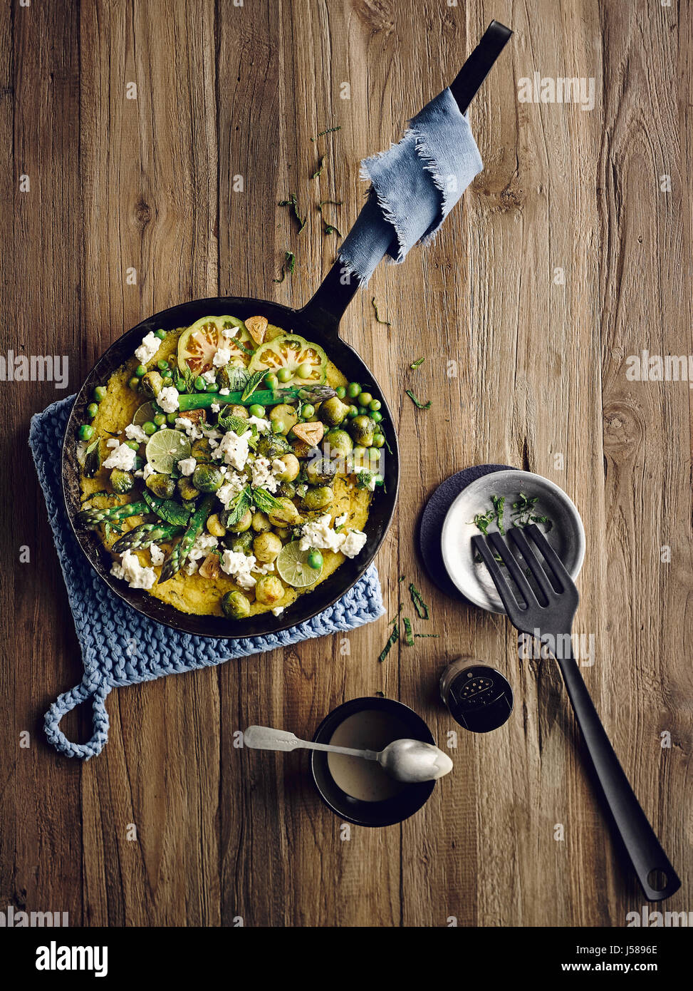 Mint polenta with brussel sprouts, goat cheese and sesame sauce Stock Photo