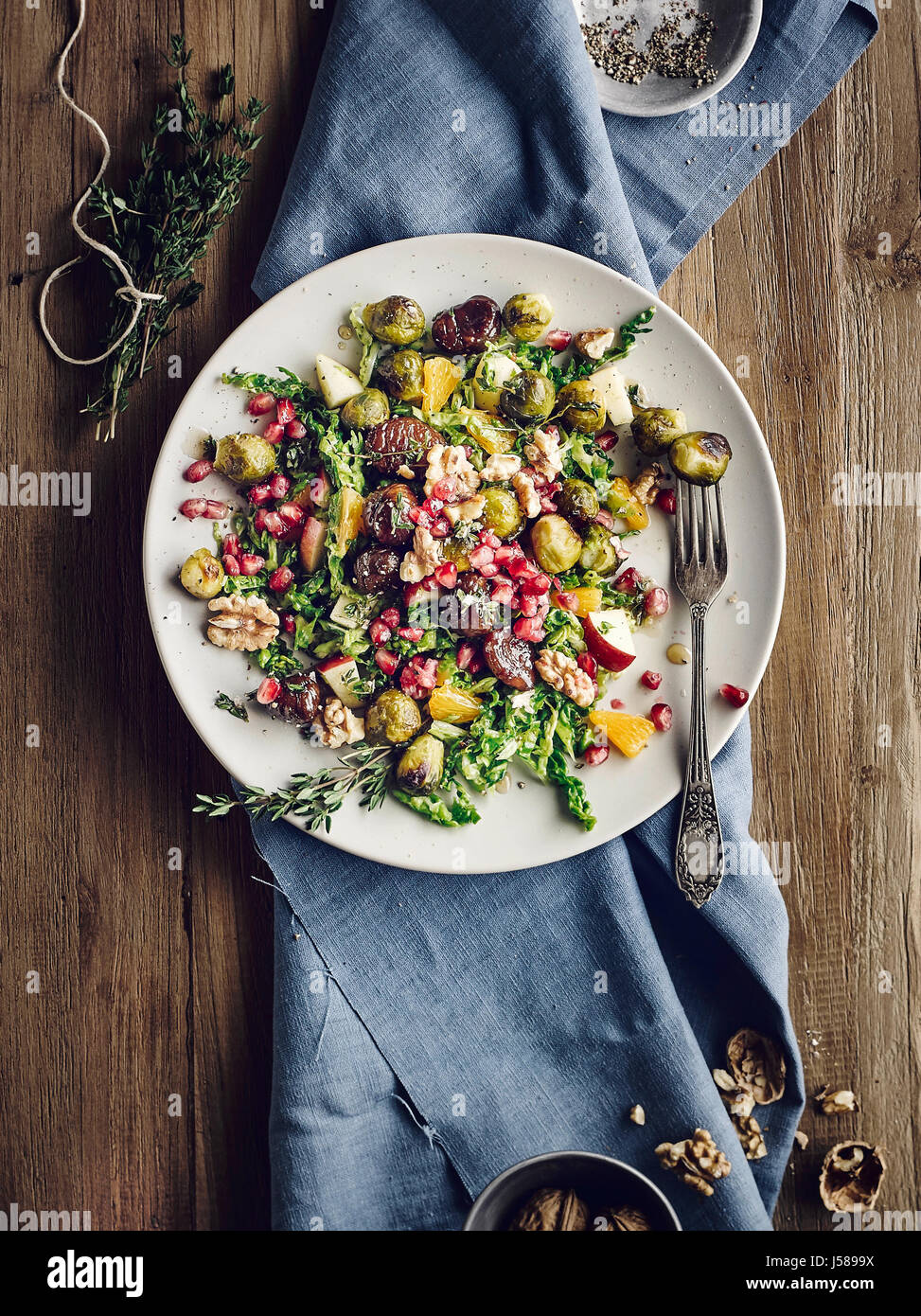 Brussel sprout salad with savoy cabbage and glazed sweet chestnuts Stock Photo