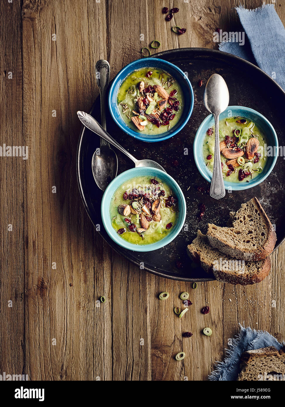 Brussel sprouts soup with salted almonds and barberries Stock Photo