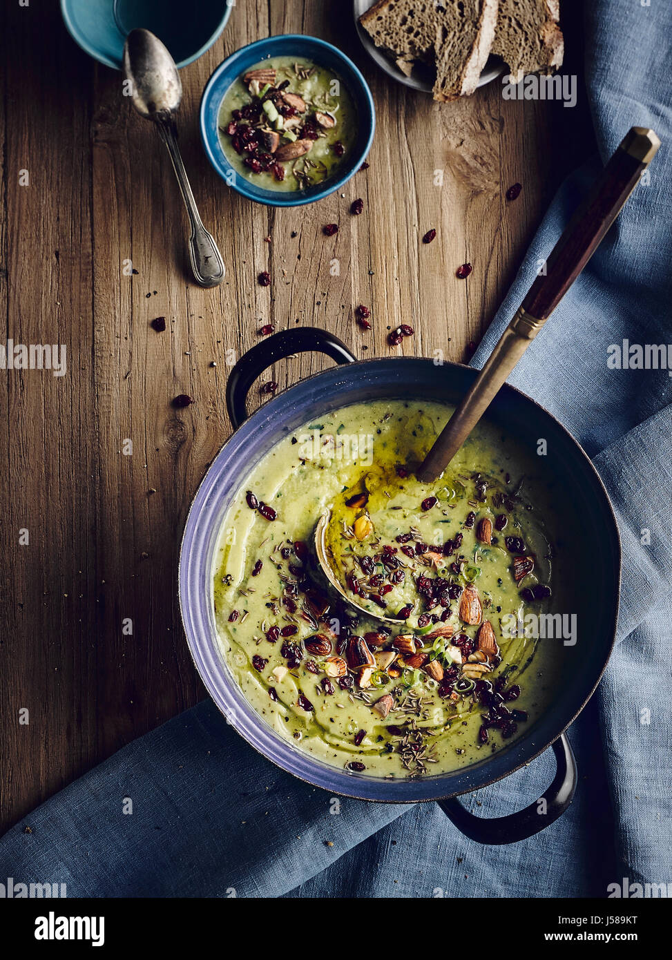 Brussel sprouts soup with salted almonds and barberries Stock Photo