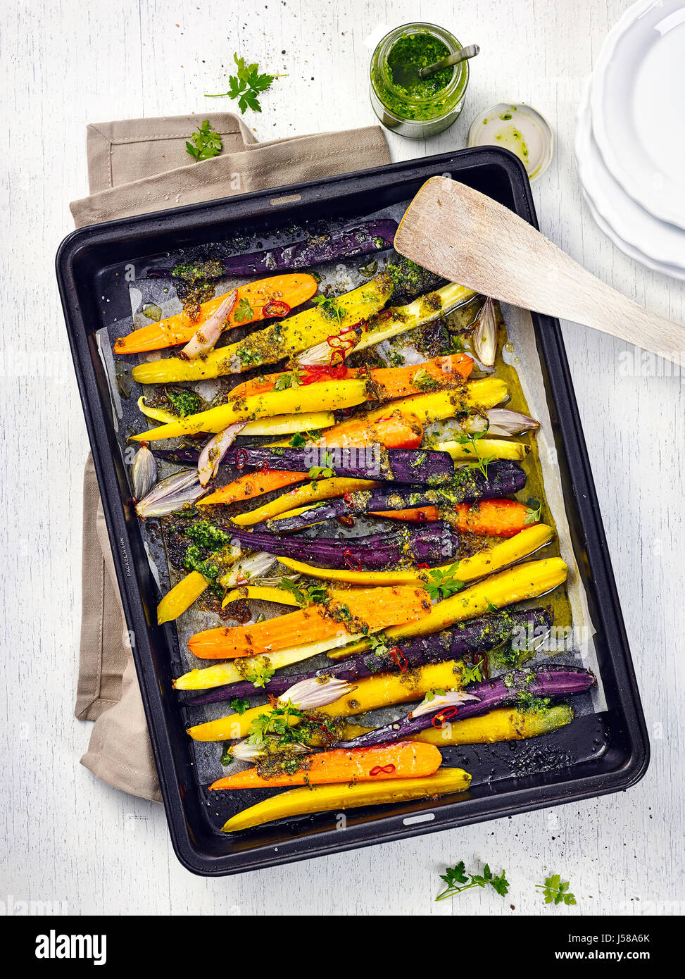 Baked carrots with kale pesto Stock Photo