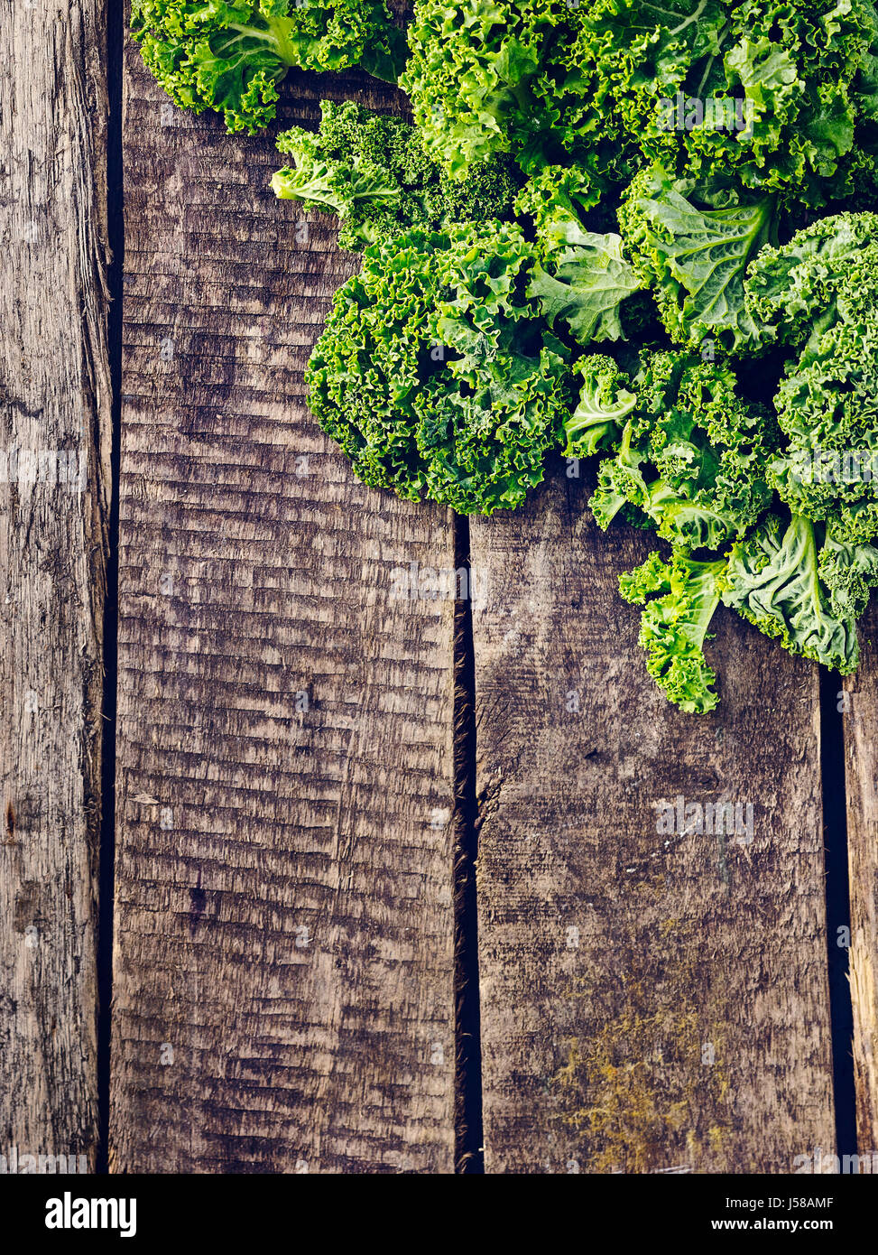 Kale on wooden surface Stock Photo