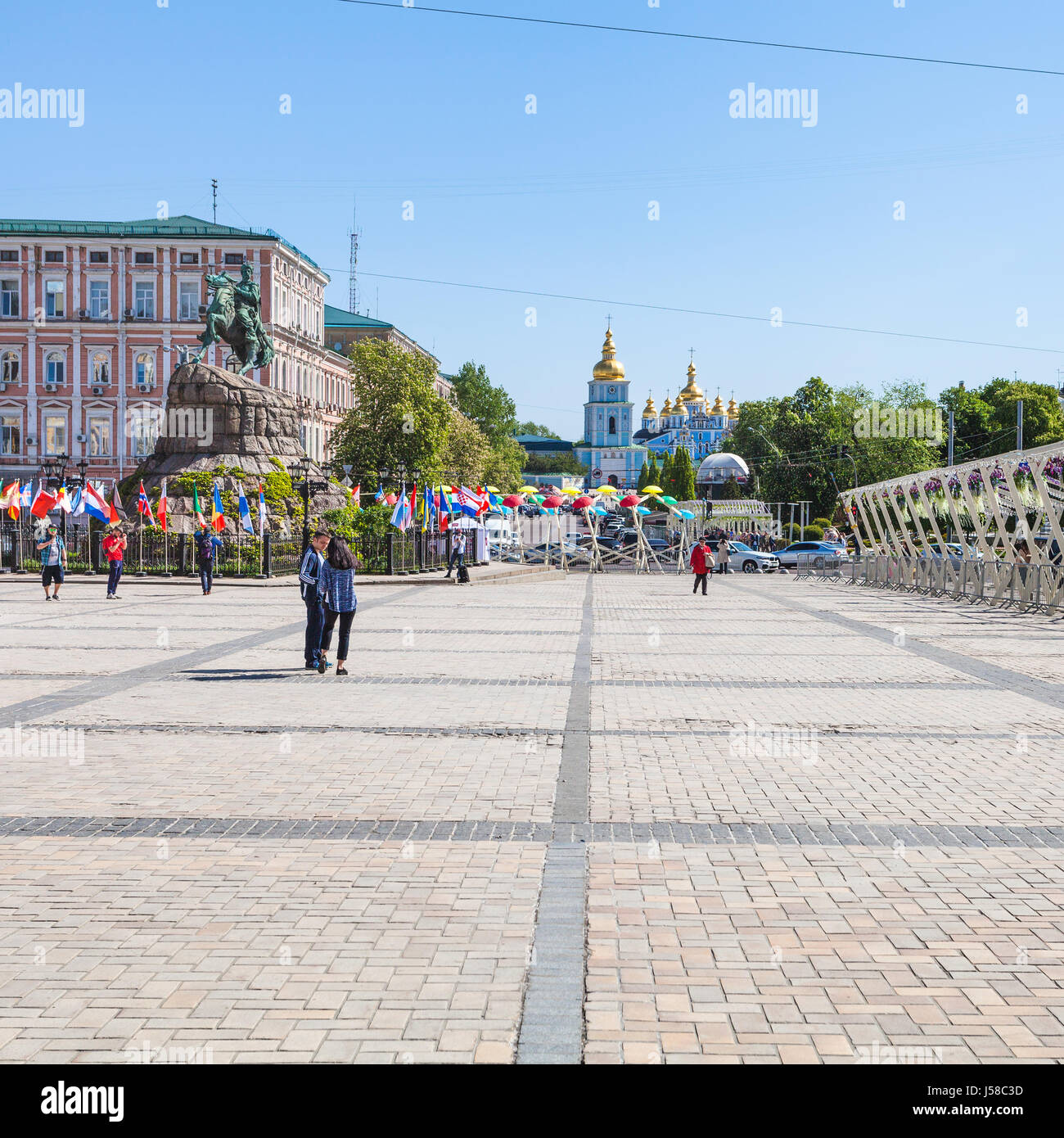 KIEV, UKRAINE - MAY 5, 2017: view of Saint Michael's Golden-Domed Monastery from St Sophia Square with tourists in Kiev city. The monastery was founde Stock Photo