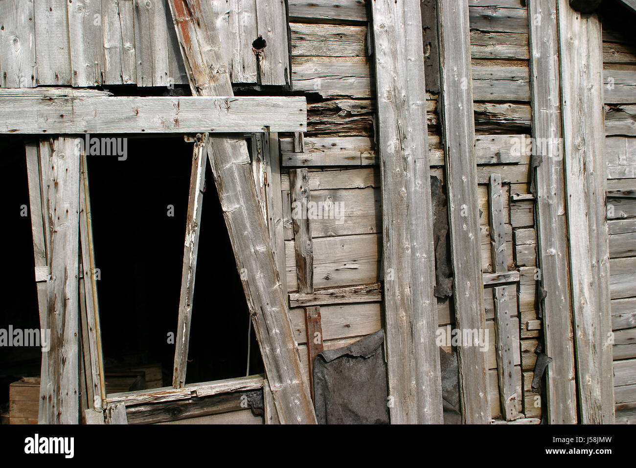 framehouse hovel rotten canvas blowzed boarding building material expiry date Stock Photo