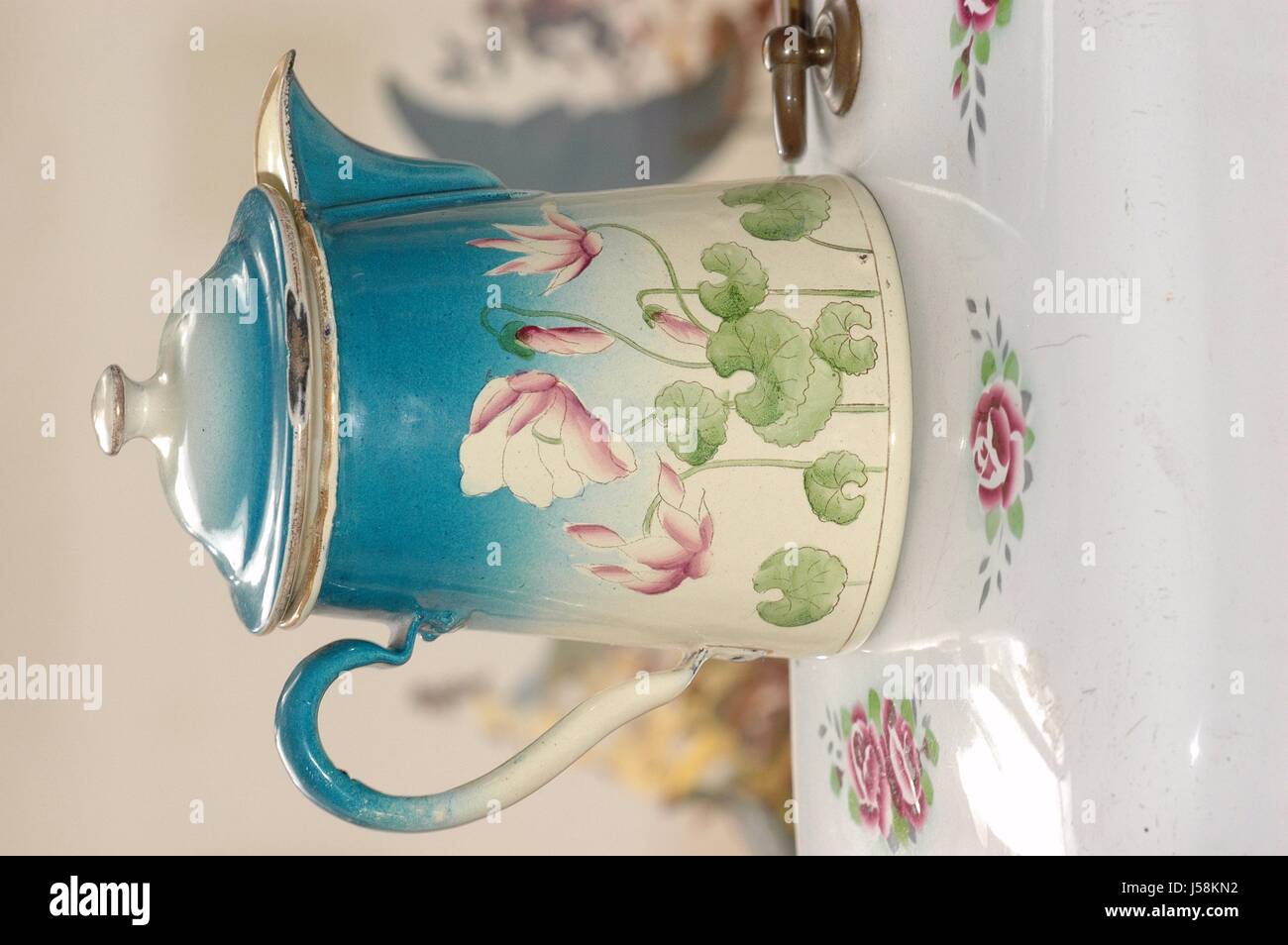 old enamel coffee pot with floral motif Stock Photo