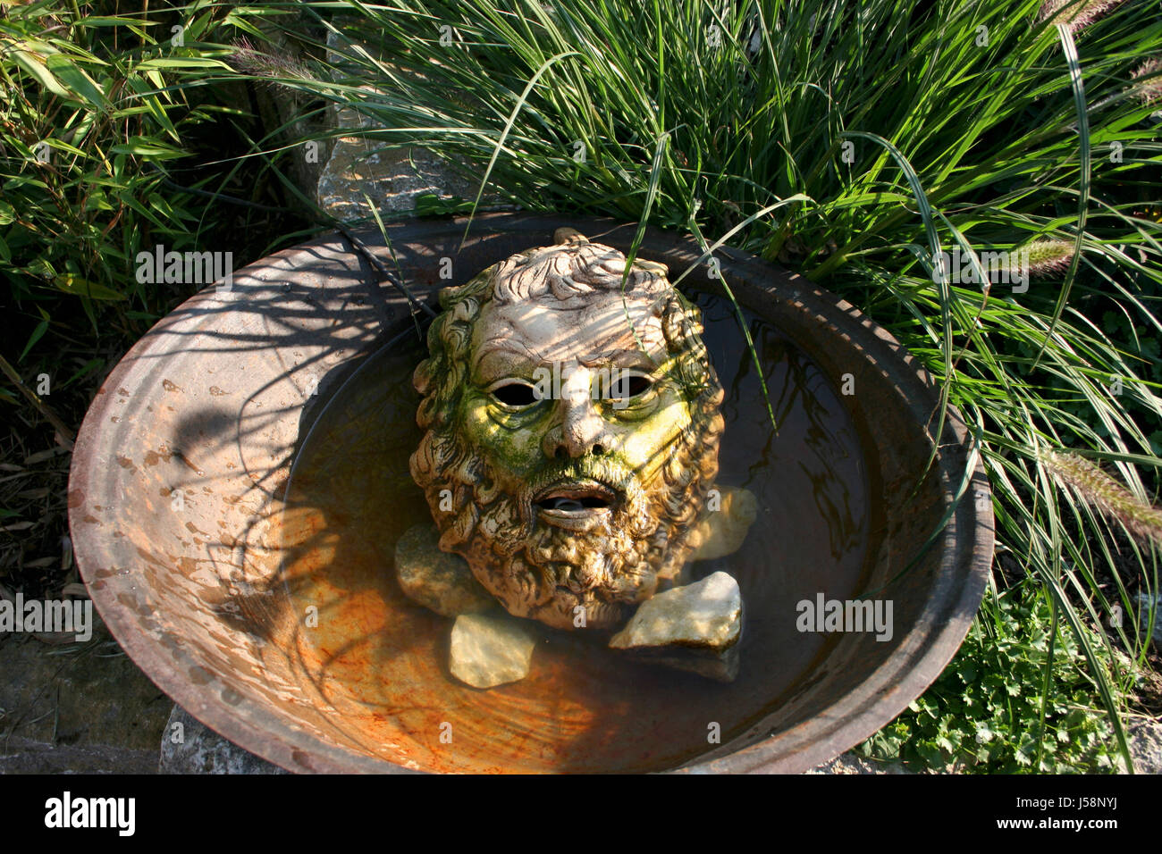 stone antique face greek ornament beard deco decoration blade blades blades of Stock Photo