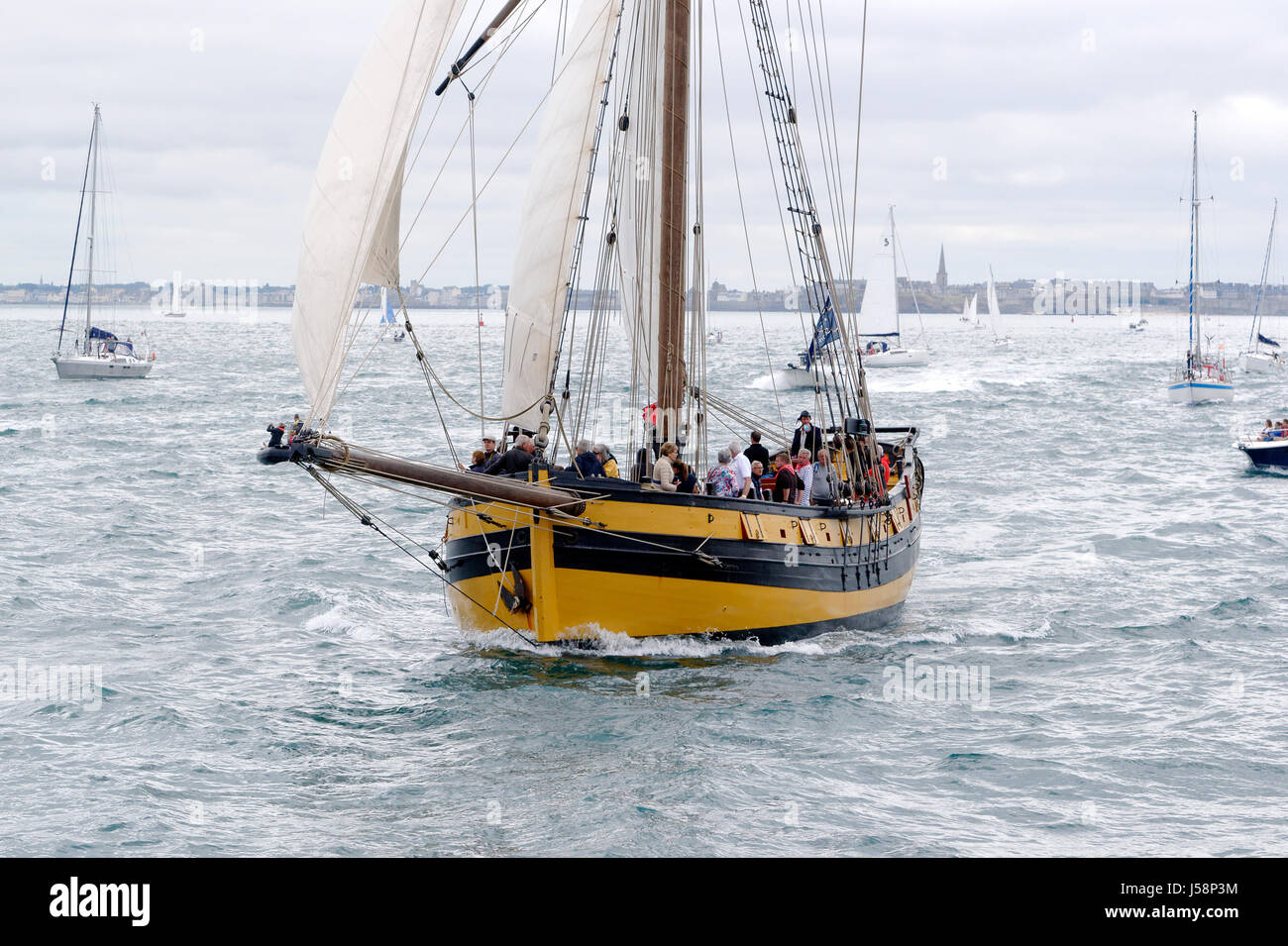 Corsair cutter Le Renard, replica in the main channel of Saint-Malo (Ille et Vilaine, Brittany, France). Stock Photo