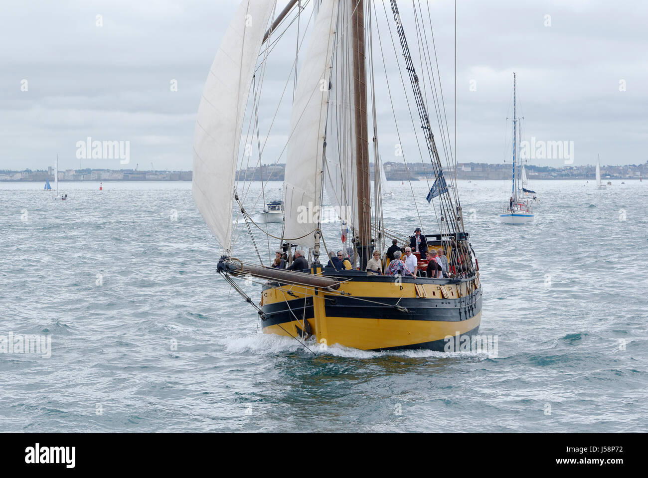 Corsair cutter Le Renard, replica in the main channel of Saint-Malo (Ille et Vilaine, Brittany, France). Stock Photo