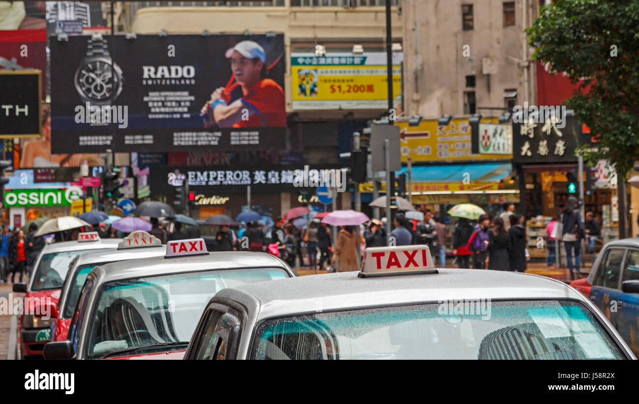 Hong Kong, China.  Taxi stand in Causeway Bay district. Busy city street. Stock Photo