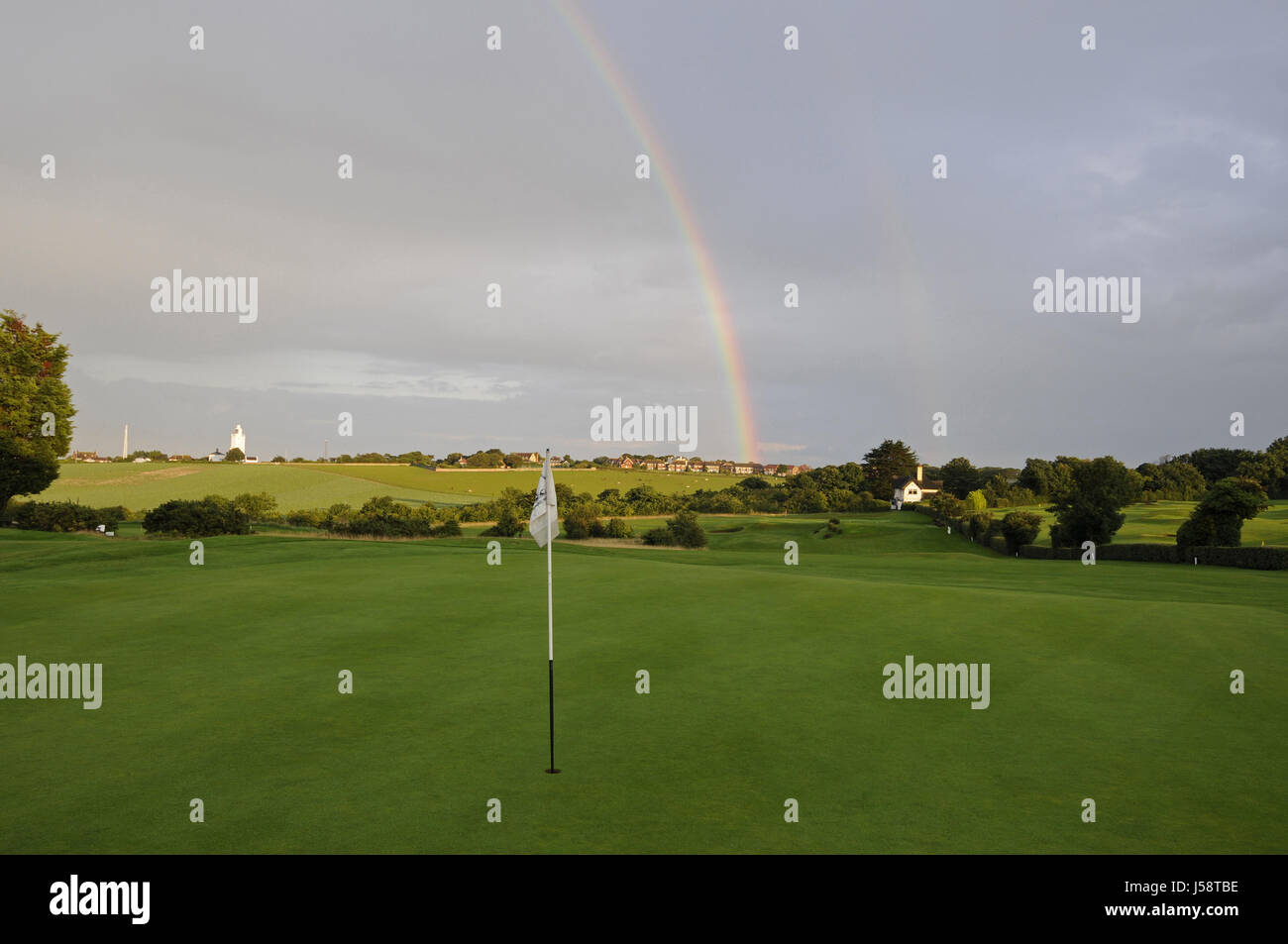 View over the 18th Green towards 17th Hole and Lighthouse with Rainbow, North Foreland Golf Club, Broadstairs, Kent, England Stock Photo