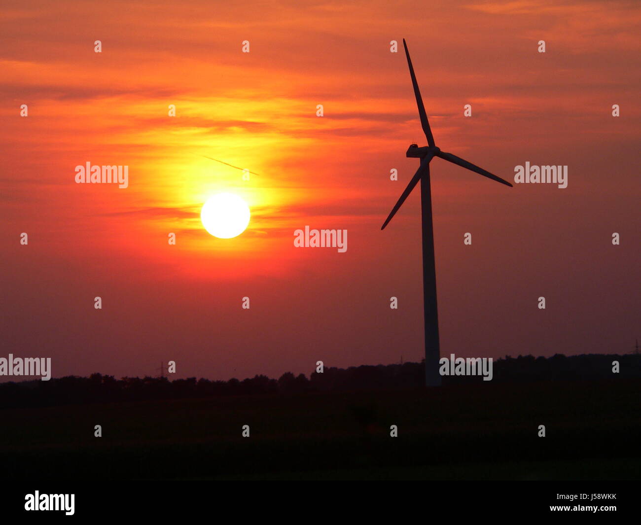 sunset field energy power electricity electric power wind force power Stock Photo