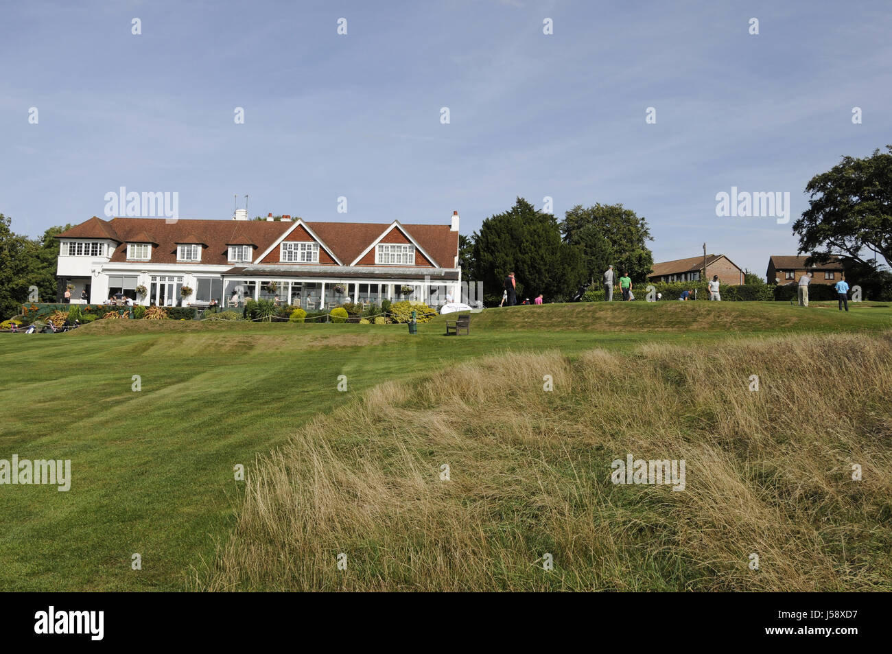 View back from 1st fairway over fescue grass to the Clubouse on the top of the hill, Purley Downs Golf Course, Croydon, Surrey, England Stock Photo