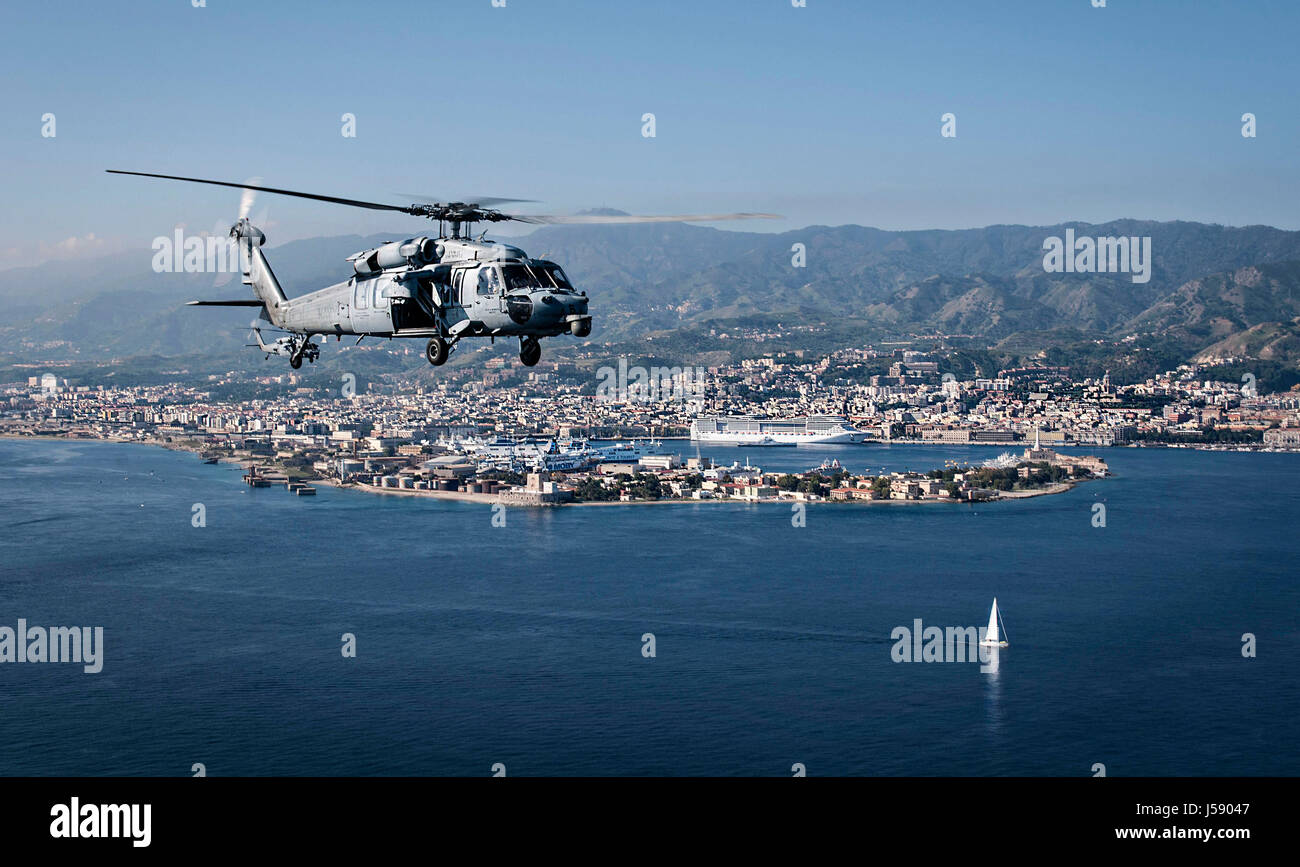 A USN MH-60S Seahawk helicopter flies over the Mediterranean Sea October 29, 2013 near Naples, Italy.    (photo by MCSS Kole E. Carpenter /US Navy  via Planetpix ) Stock Photo