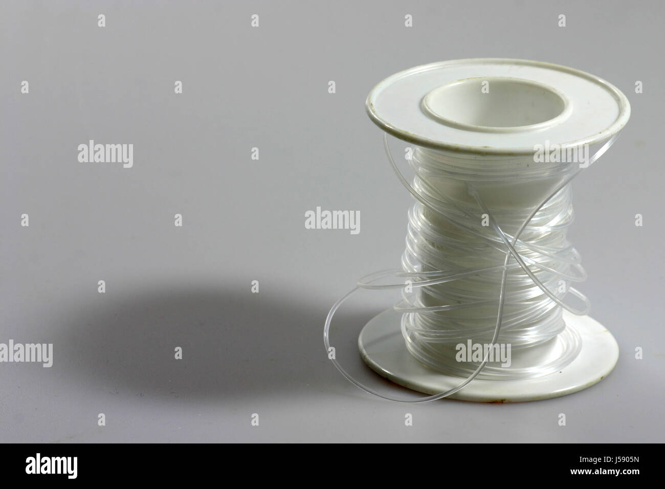 thread plastic synthetic material roll string packthreads threads  fortification Stock Photo - Alamy