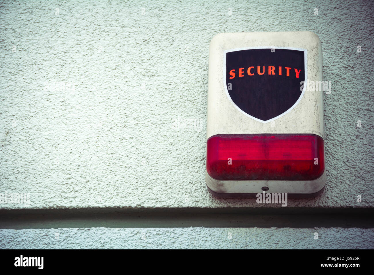 Weathered security alarm with room for text Stock Photo