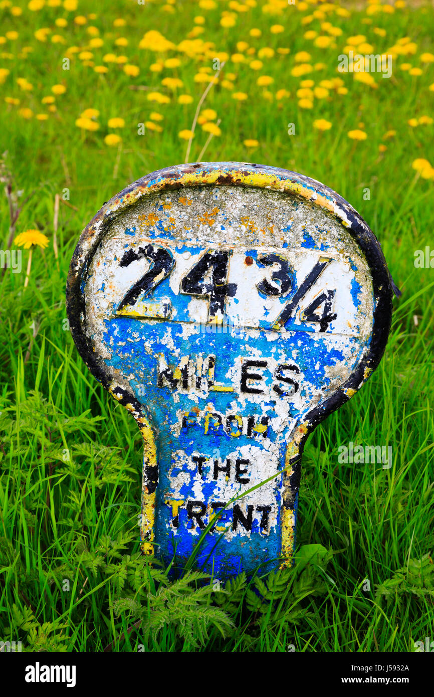 Canal mile marker on the banks of the Grantham to Nottingham near Redmile, Lincolnshire, Shows distance of 24 3/4 miles t Stock Photo