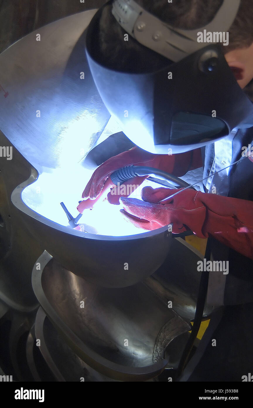 workshop turbine skilled worker bogie wheel professions qualified welding Stock Photo