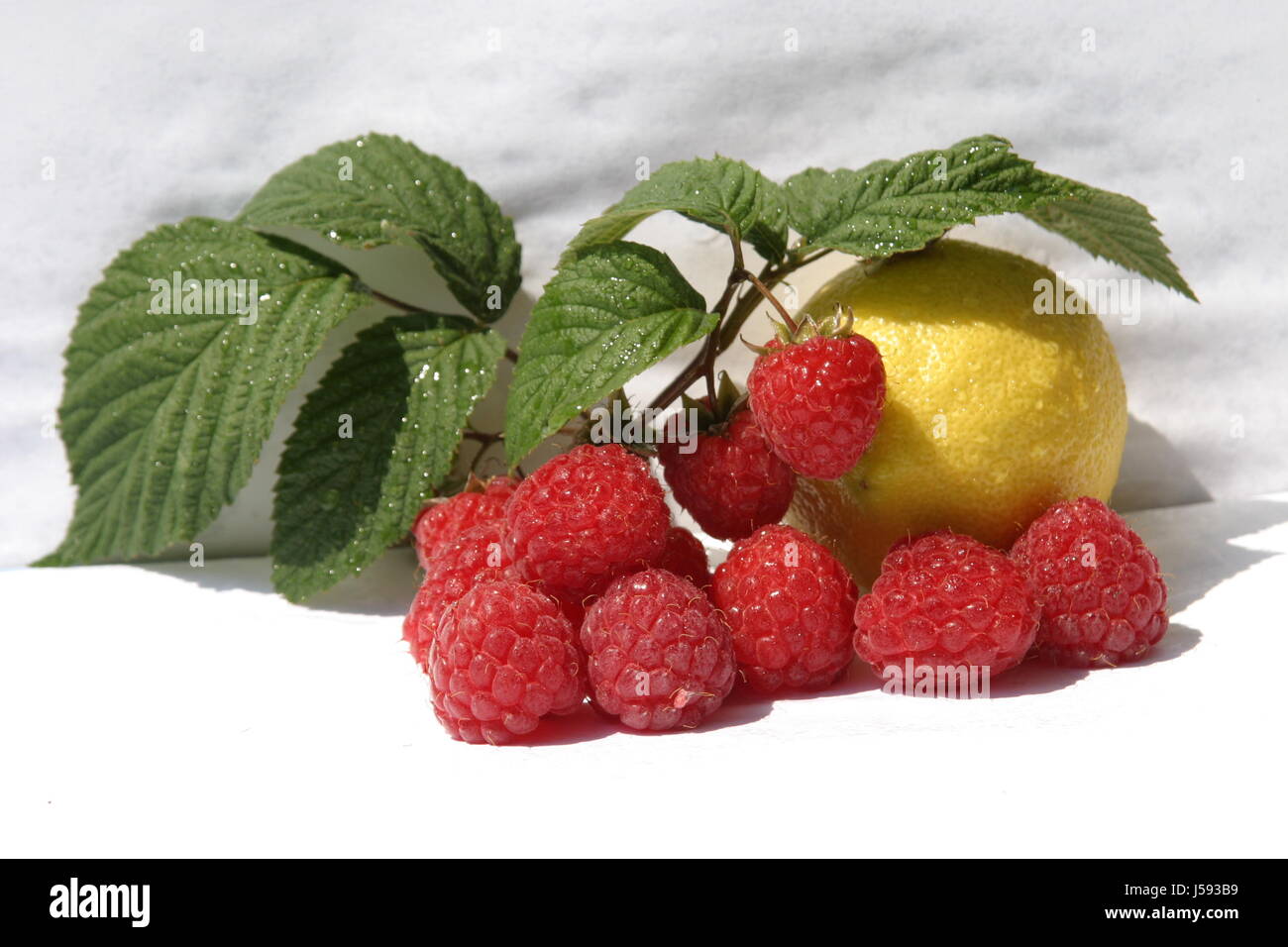 raspberries and lemon Stock Photo - Alamy