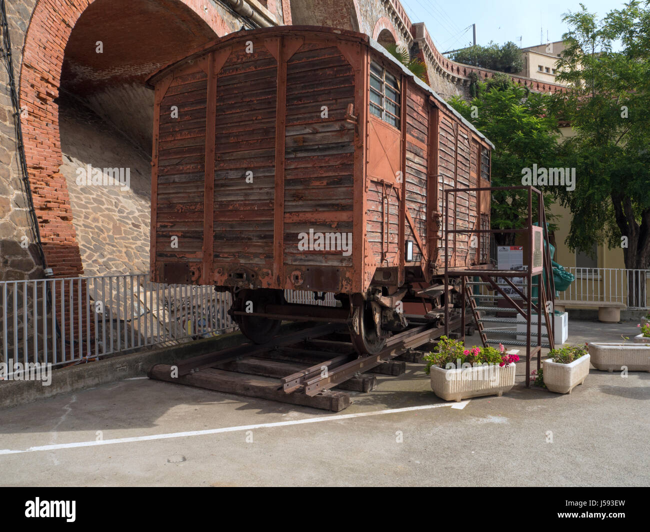 Dual gauge rail wagon on wide and standard gauge tracks outside Cerebere railway station Stock Photo