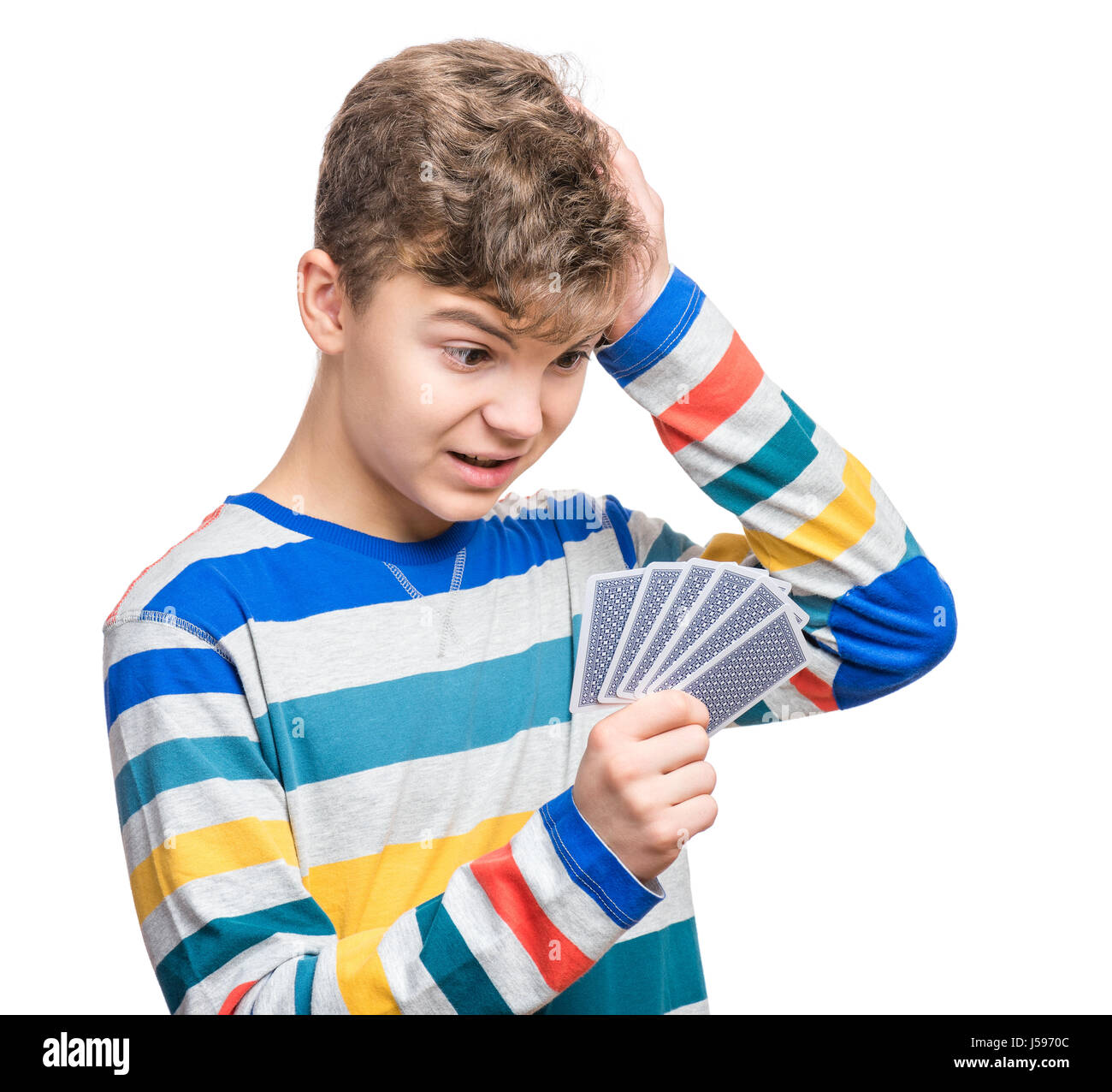 Teen boy with gamble cards Stock Photo