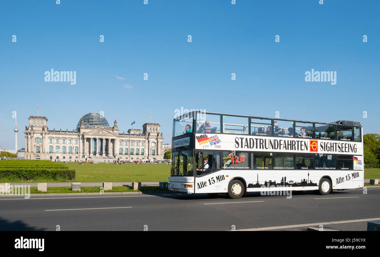 Tourist sightseeing tour bus in front of the Reichstag in Berlin, Germany Stock Photo
