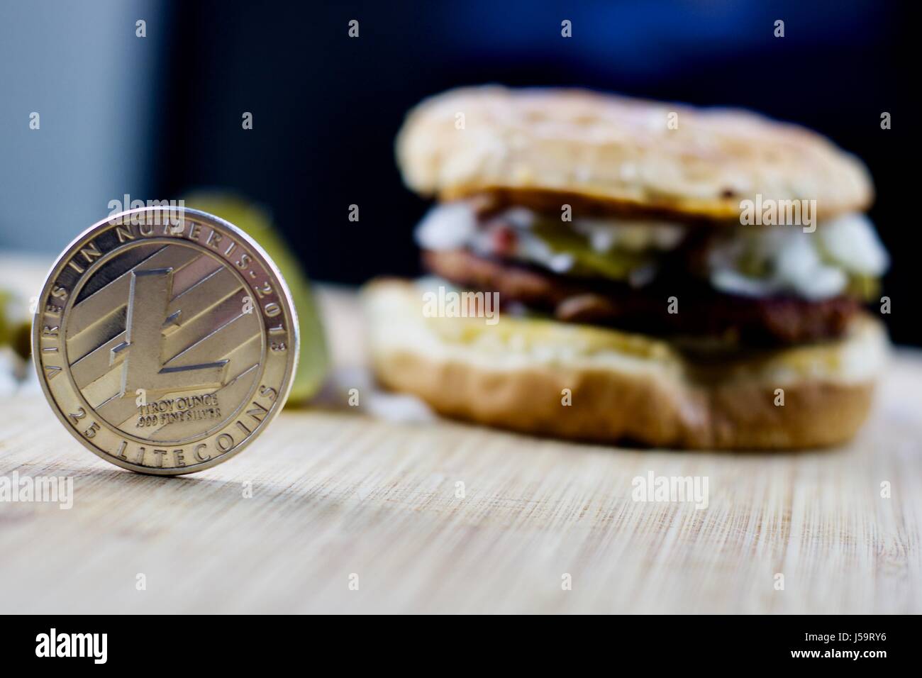 Cryptocurrency silver physical litecoin coin and veggie burger food Stock  Photo - Alamy