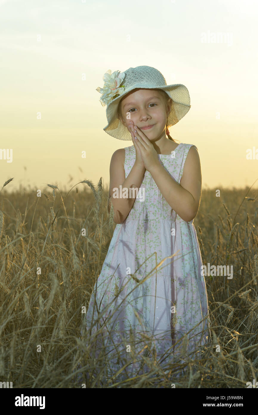 Little girl in wheat field Stock Photo - Alamy