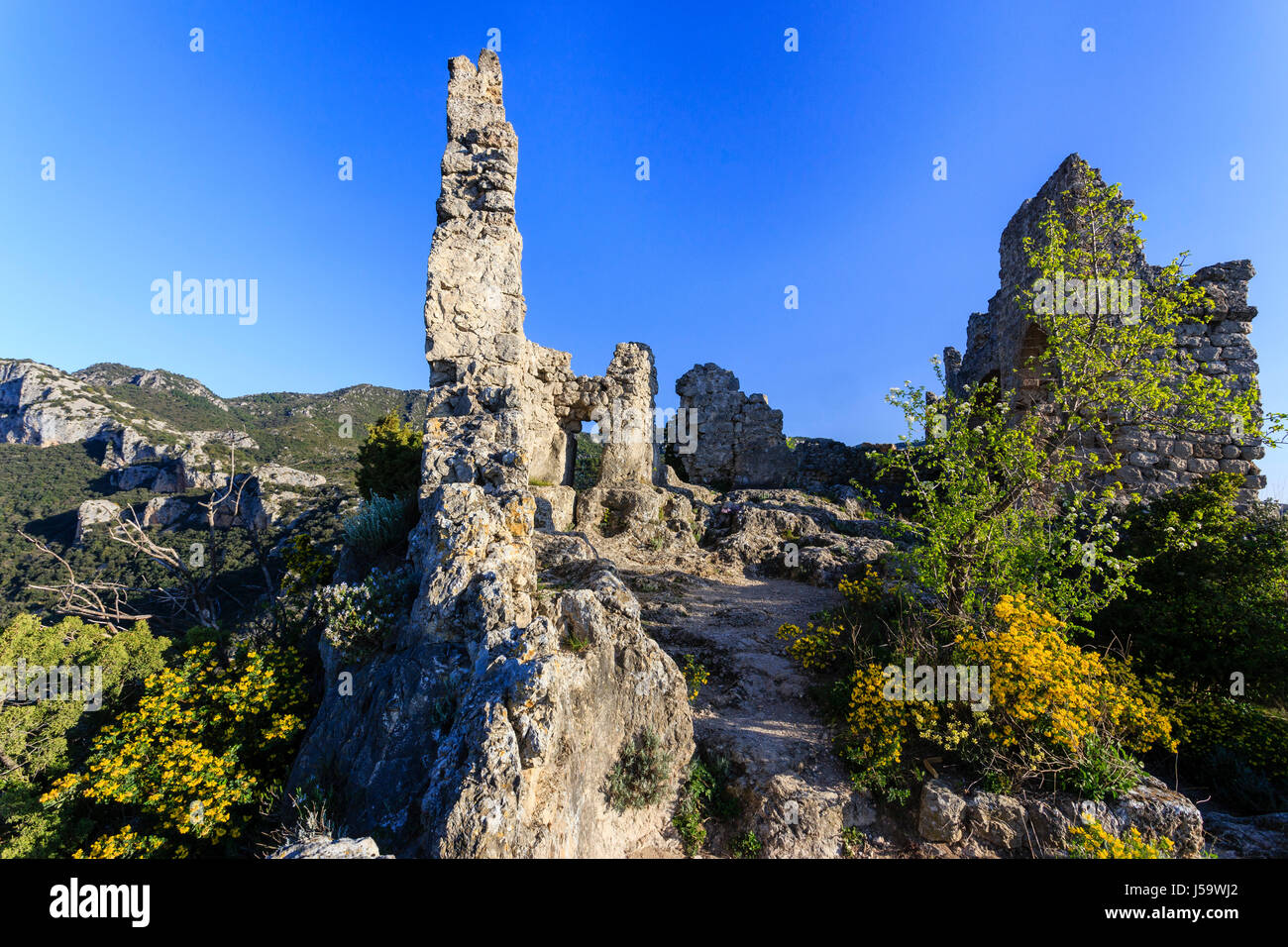 France, Herault, Saint Guilhem le Desert, labelled Les Plus Beaux Villages de France, the Geant castle ruins above the village Stock Photo