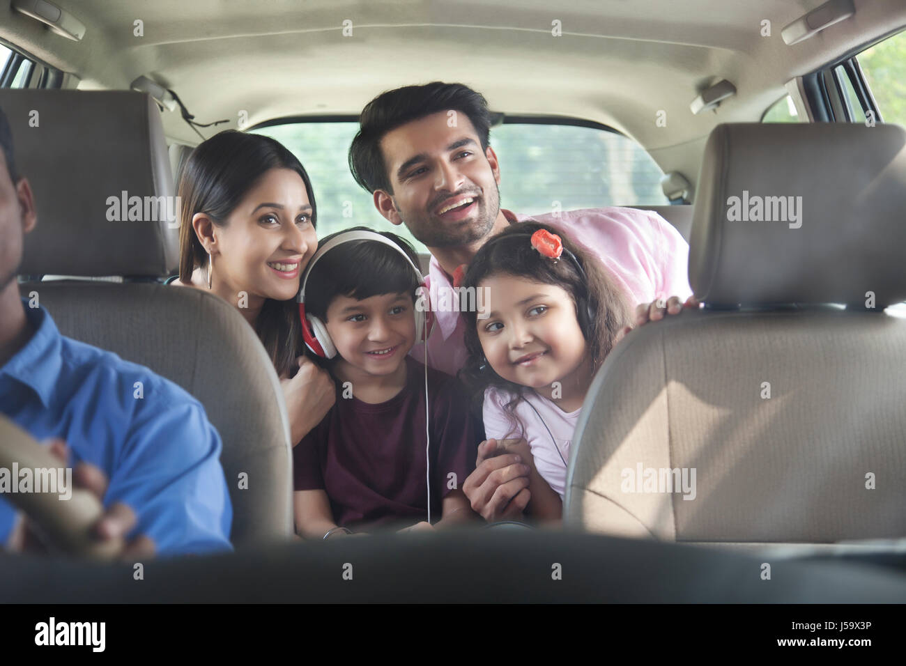 Happy family in car for road trip Stock Photo