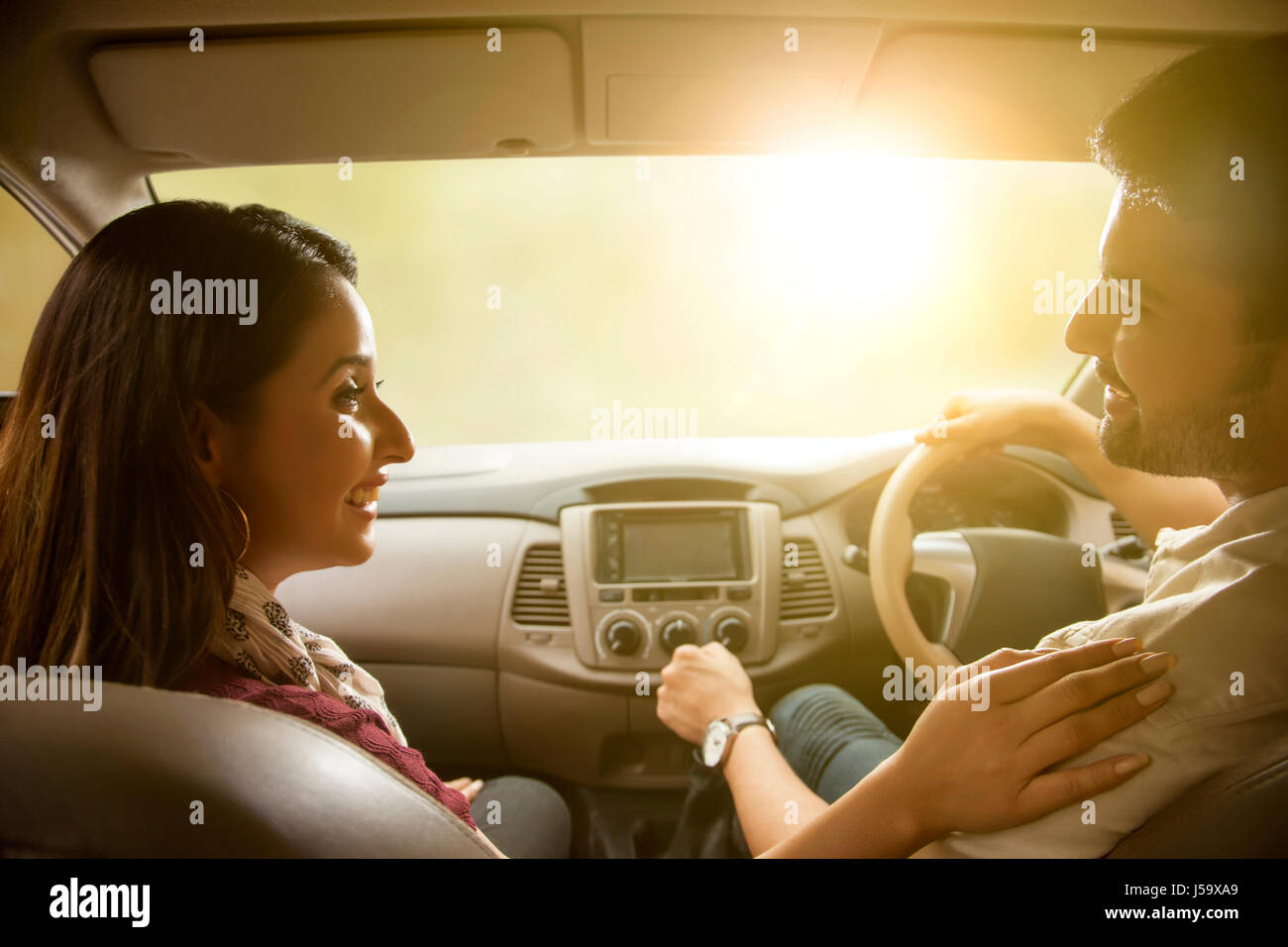 Young couple driving in car Stock Photo
