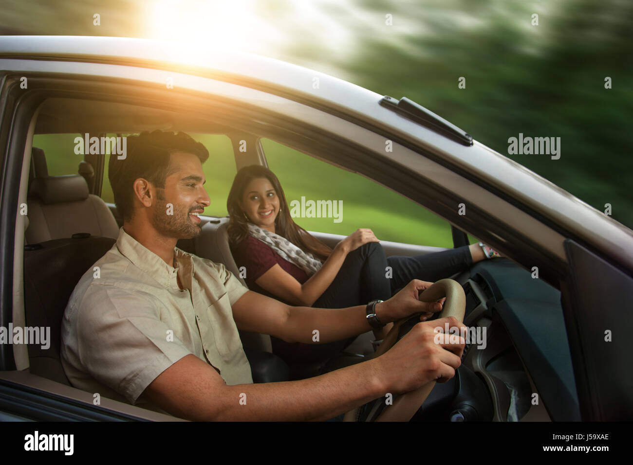 Young couple driving in car Stock Photo