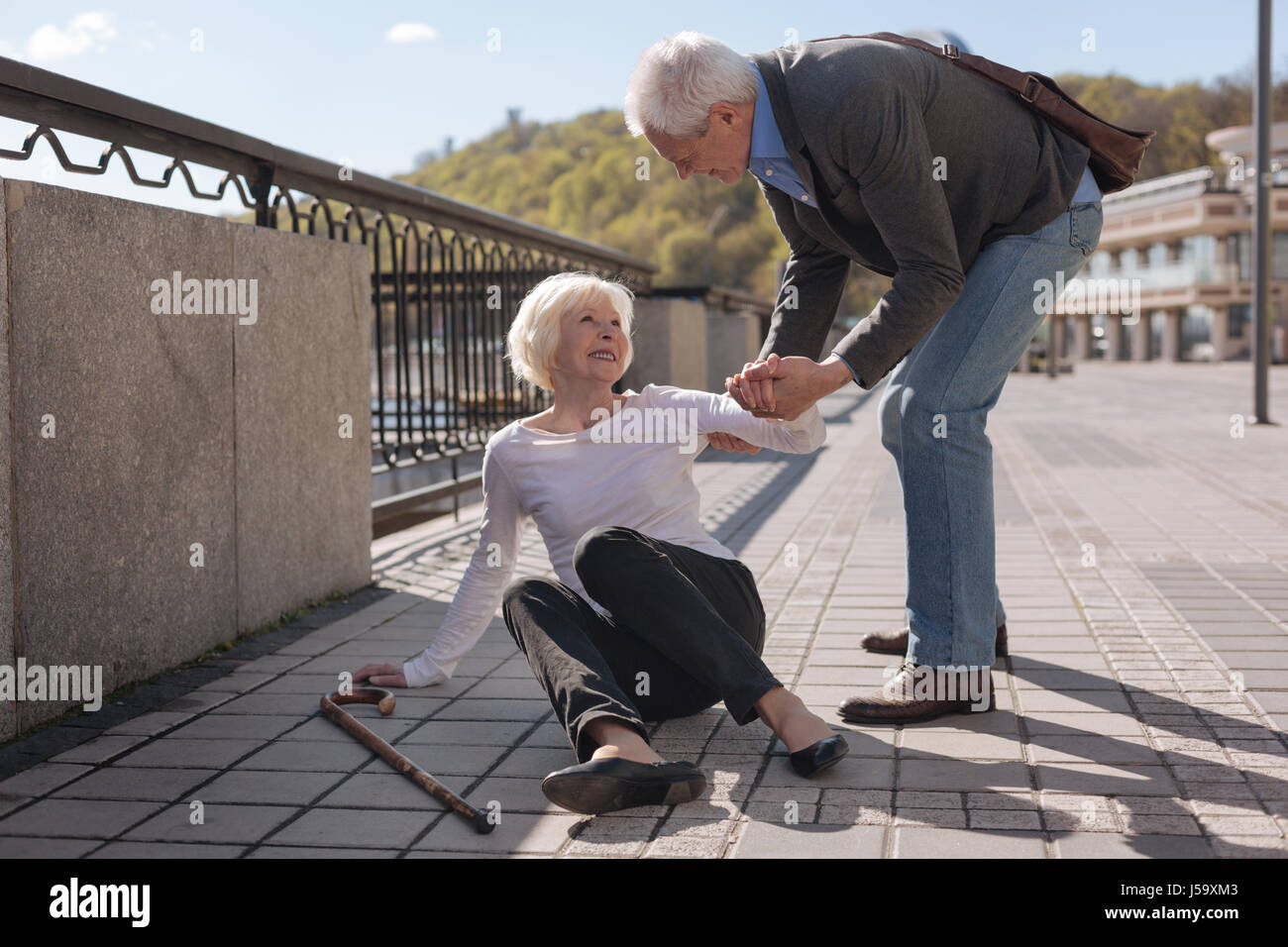 Happy retired family solving their problems in the street Stock Photo