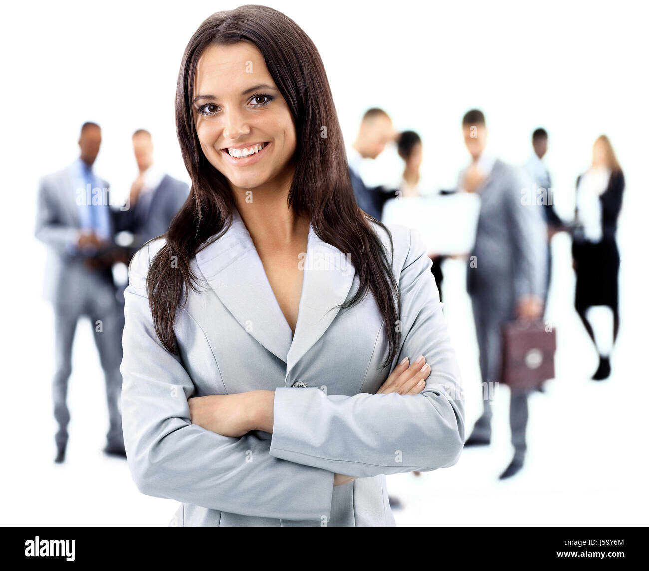 Happy young business woman standing in front of her team Stock Photo ...