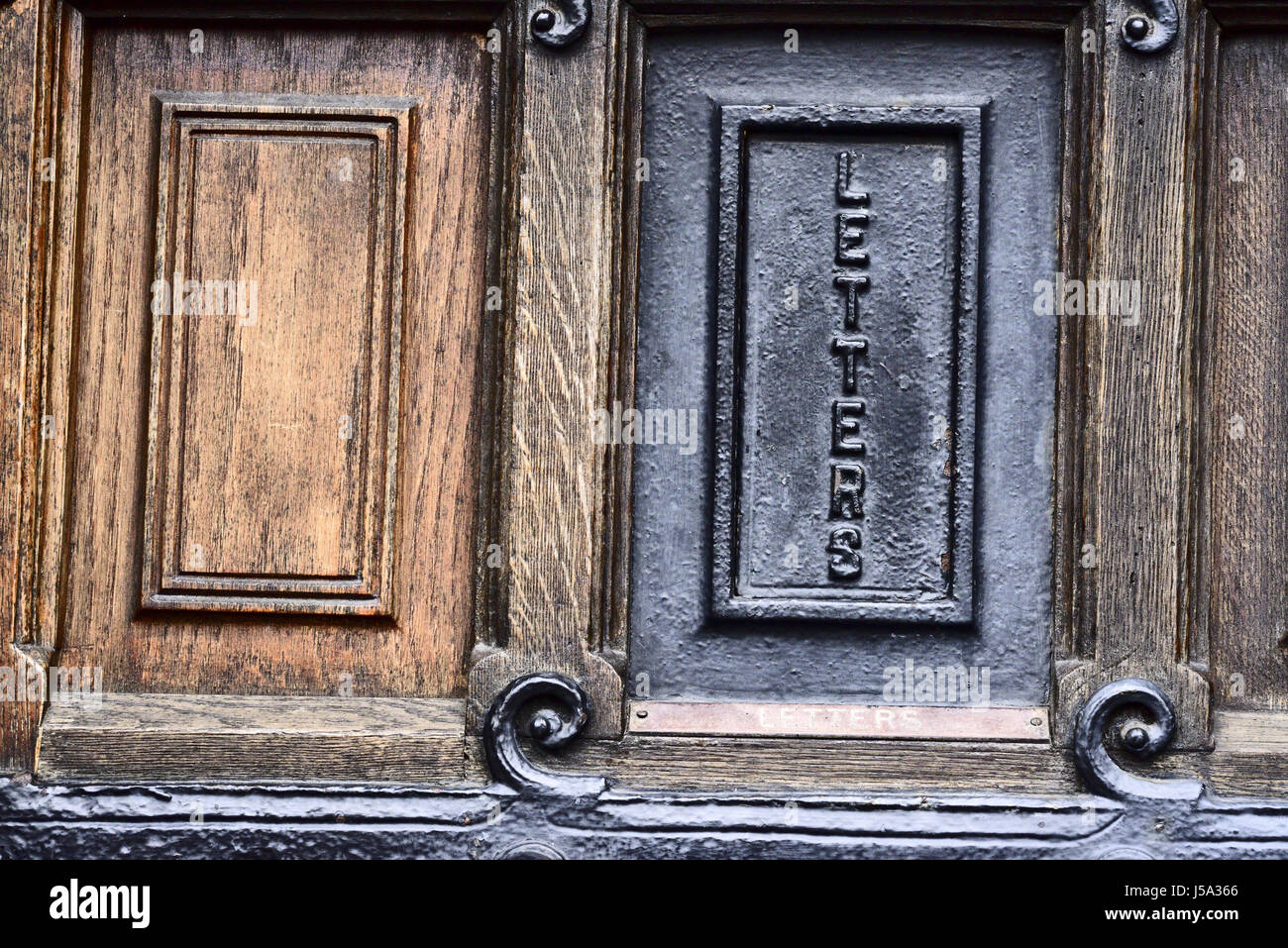 Old cast metal letter box on the Rochdale Council offices door Stock Photo