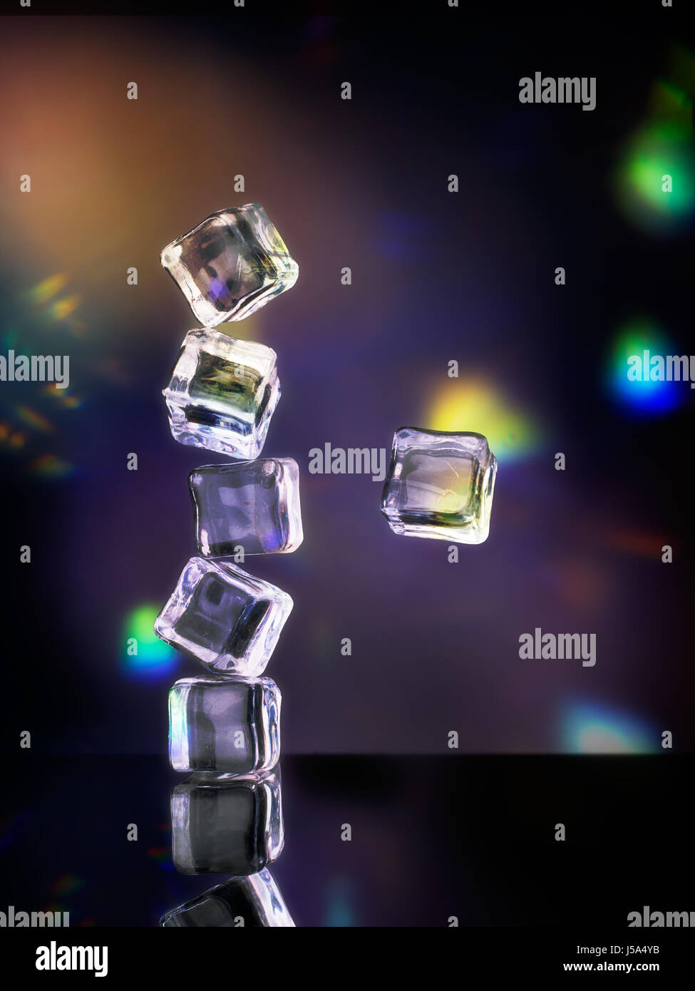 Tumbling ice. Fun party concept.Ok - fake ice. Disco lights behind ...