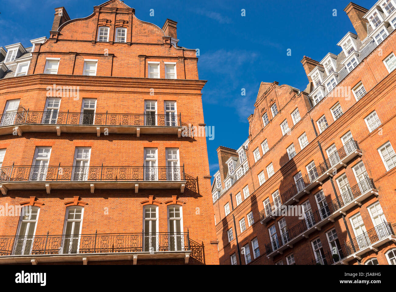 Opulent restored elegant Victorian period building in red bricks and white windows in South Kensington, London, UK Stock Photo