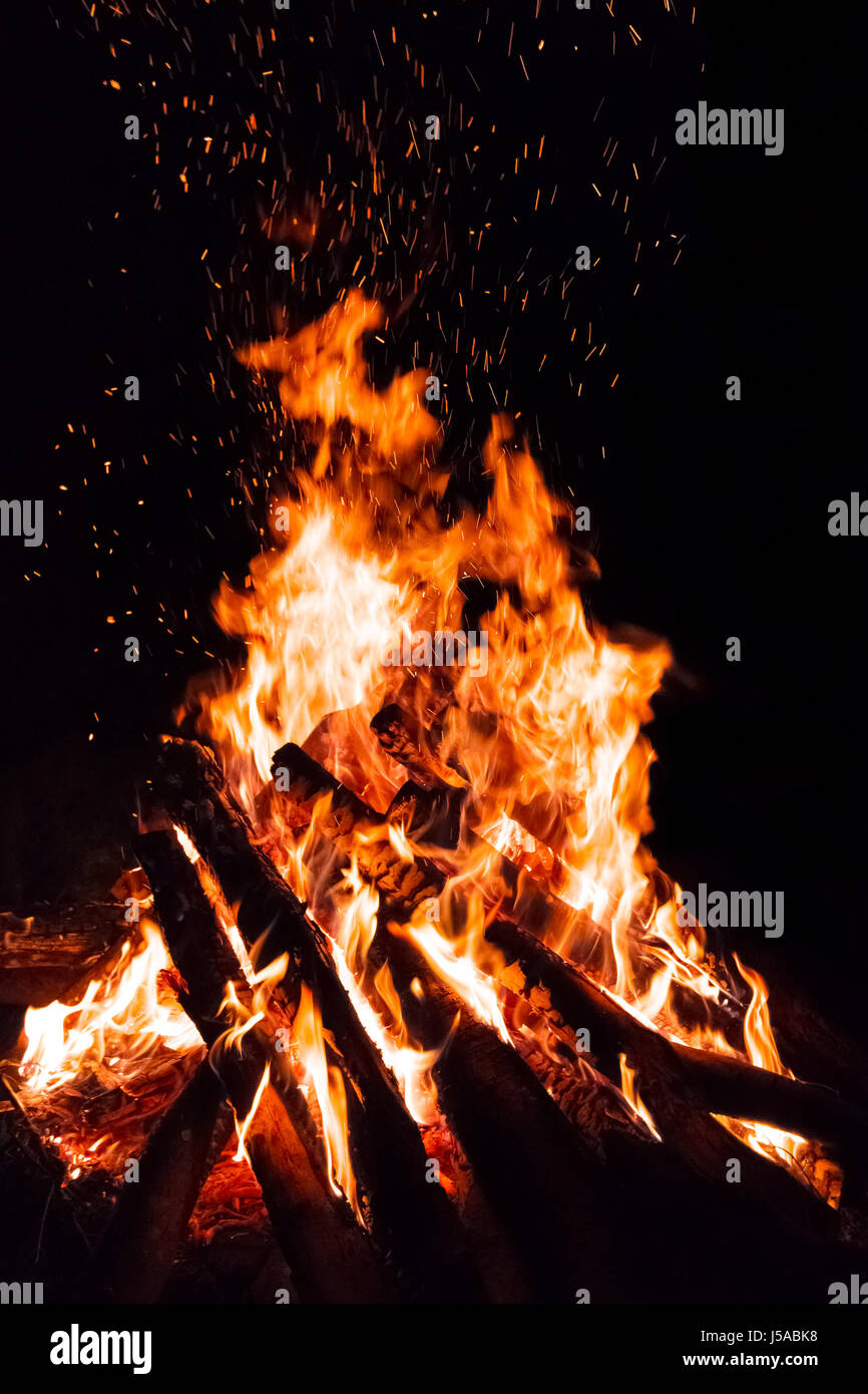 Campfire with flying sparks isolated on black background Stock Photo ...