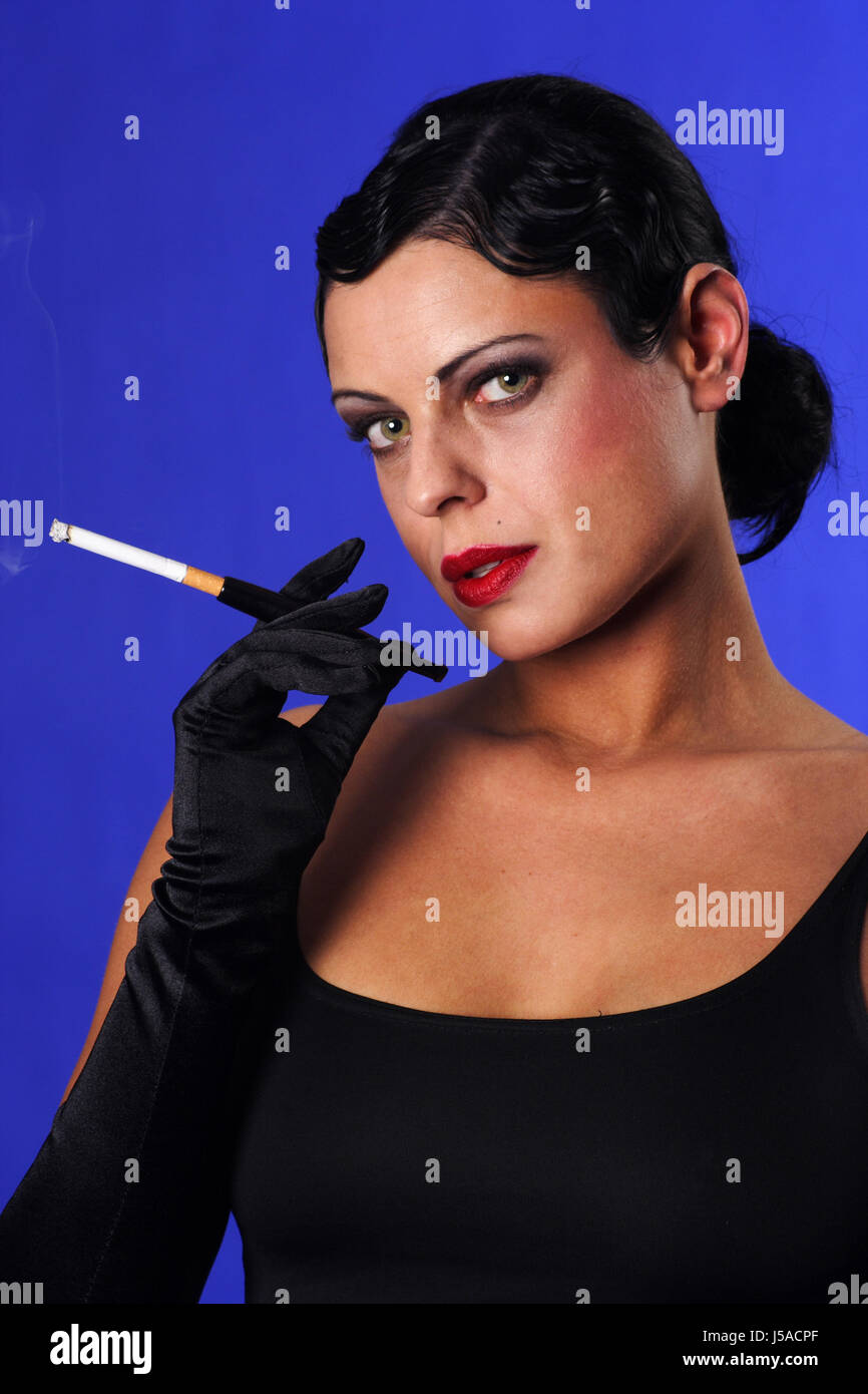 Woman smoking cigarette holder hires stock photography and images Alamy
