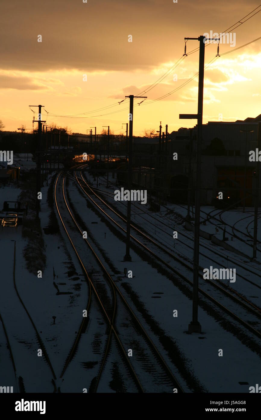 railway locomotive train engine rolling stock vehicle means of travel sunset Stock Photo