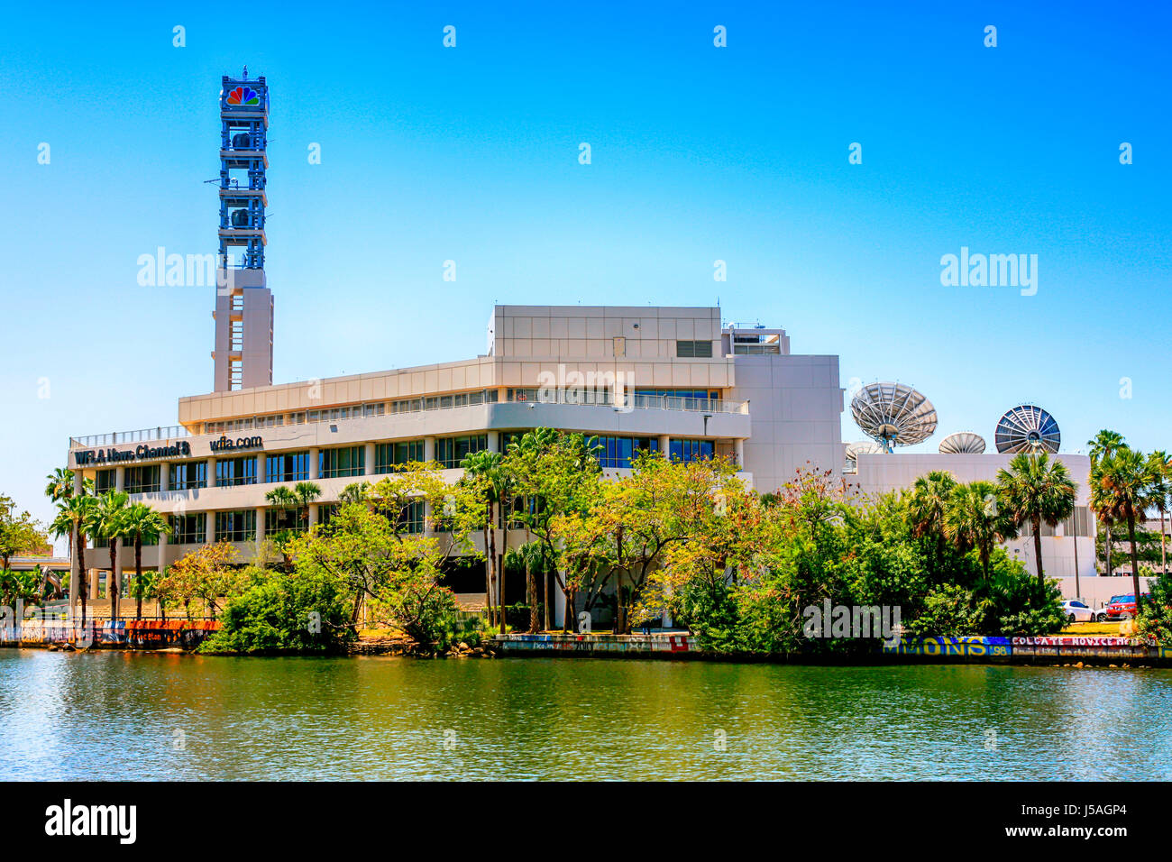 The WFLA News Channel 8 building on the Hillsboro River in downtown Tampa, FL Stock Photo