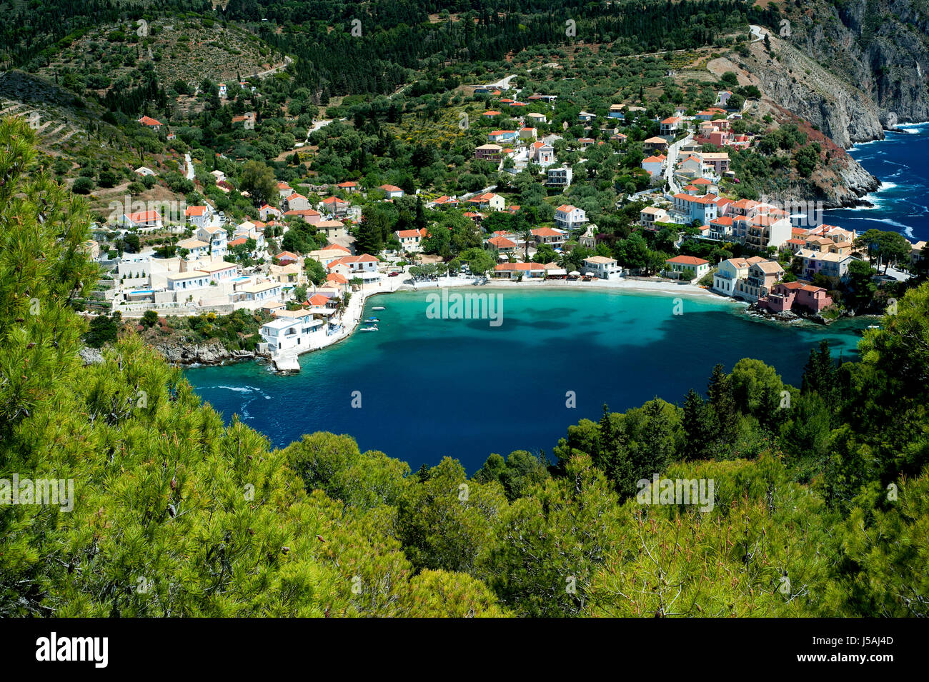 Assos, Kefalonia, Greece, 2017. The village of Assos is located on and around a narrow isthmus and a beautiful bay on the holiday island of Kefalonia. Stock Photo
