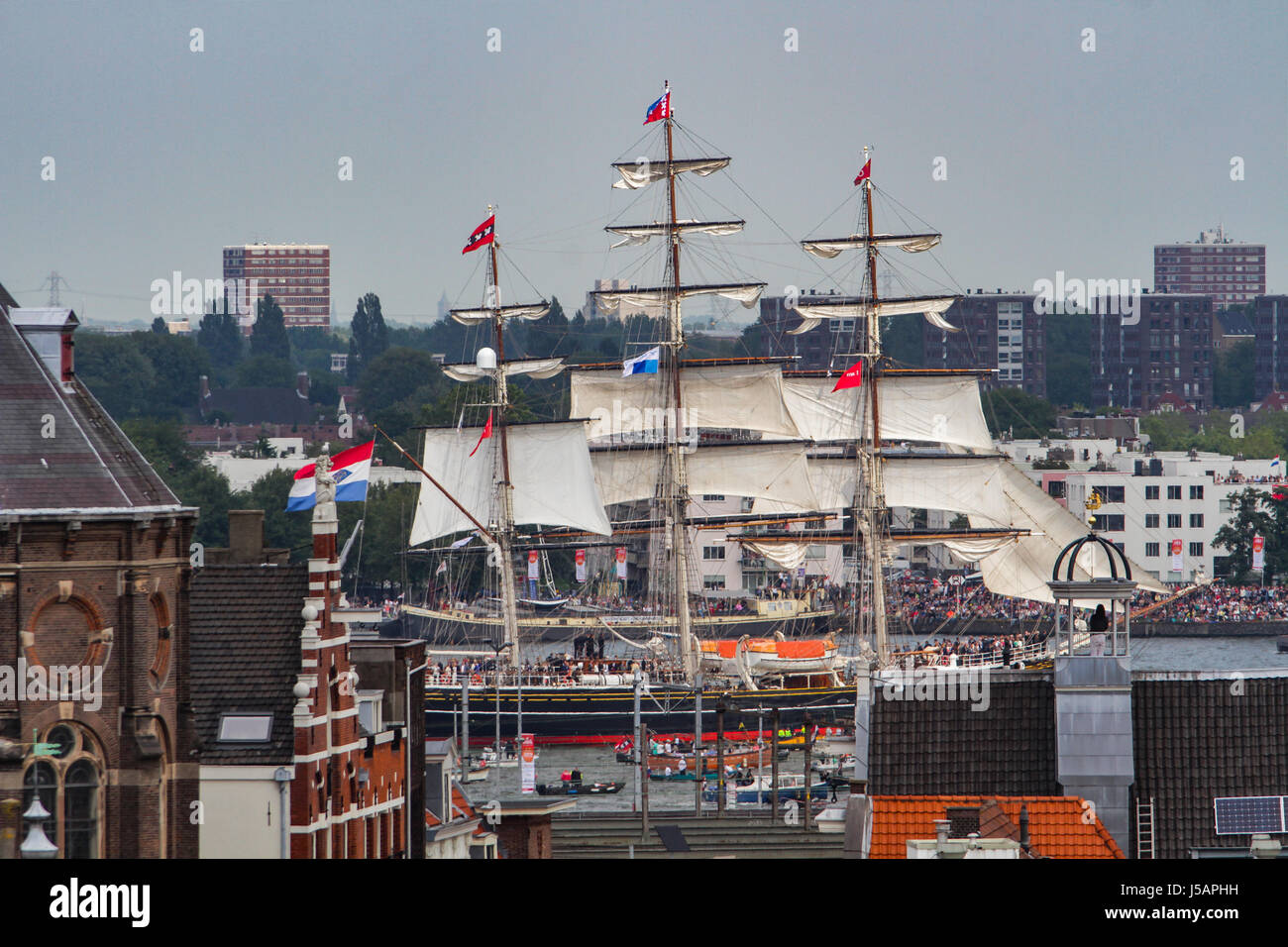 Amsterdam, Netherlands. 19th Aug, 2015. SAIL Amsterdam 2015, Sail In Parade on first day (of 5, 19th to 23th Aug): three-masted clipper Stad Amsterdam (city of Amsterdam), Netherlands. SAIL Amsterdam is a quinquennial maritime event in Amsterdam in the Netherlands. Tall ships from all over the world visit the city to moor in its eastern harbour. - Fotocredit: Christian Lademann Stock Photo