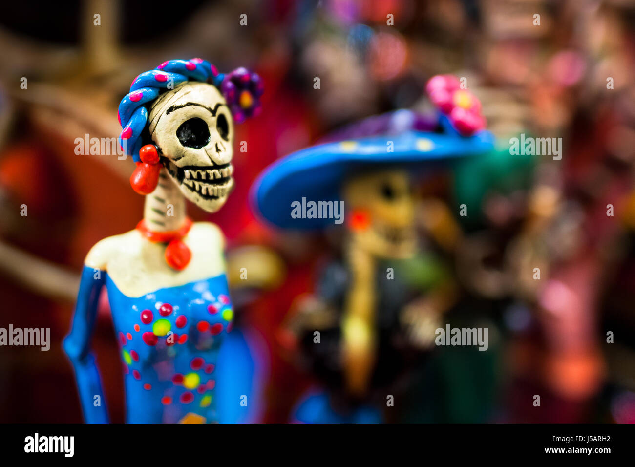Calaca figurines are sold on the market during the Day of the Dead