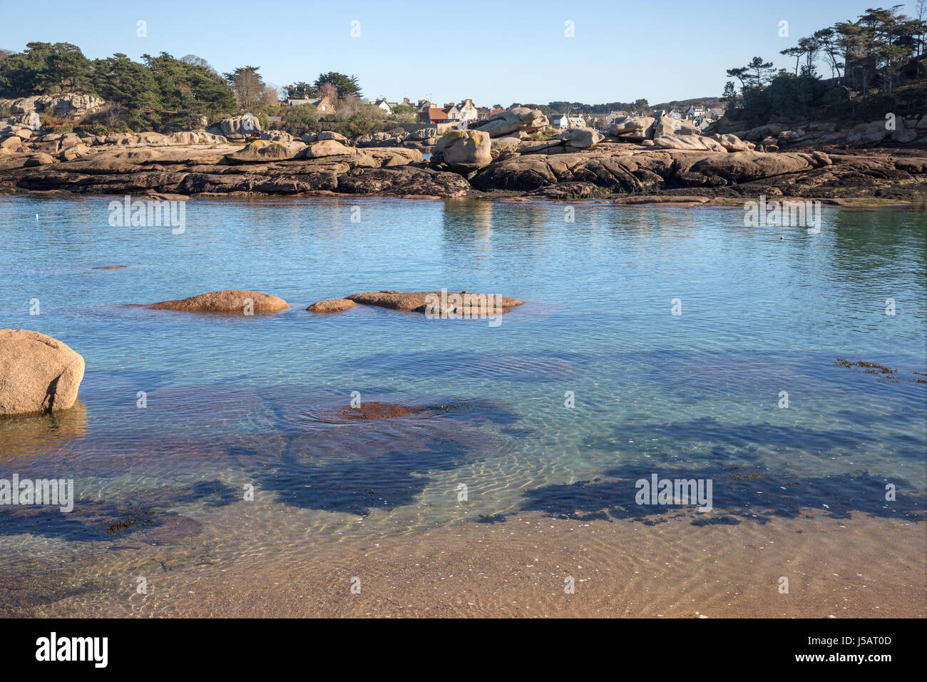 Clear water and rocky coastline along the Cote de Granit Rose between  Tregastel and Saint-Guirec, Brittany, France Stock Photo