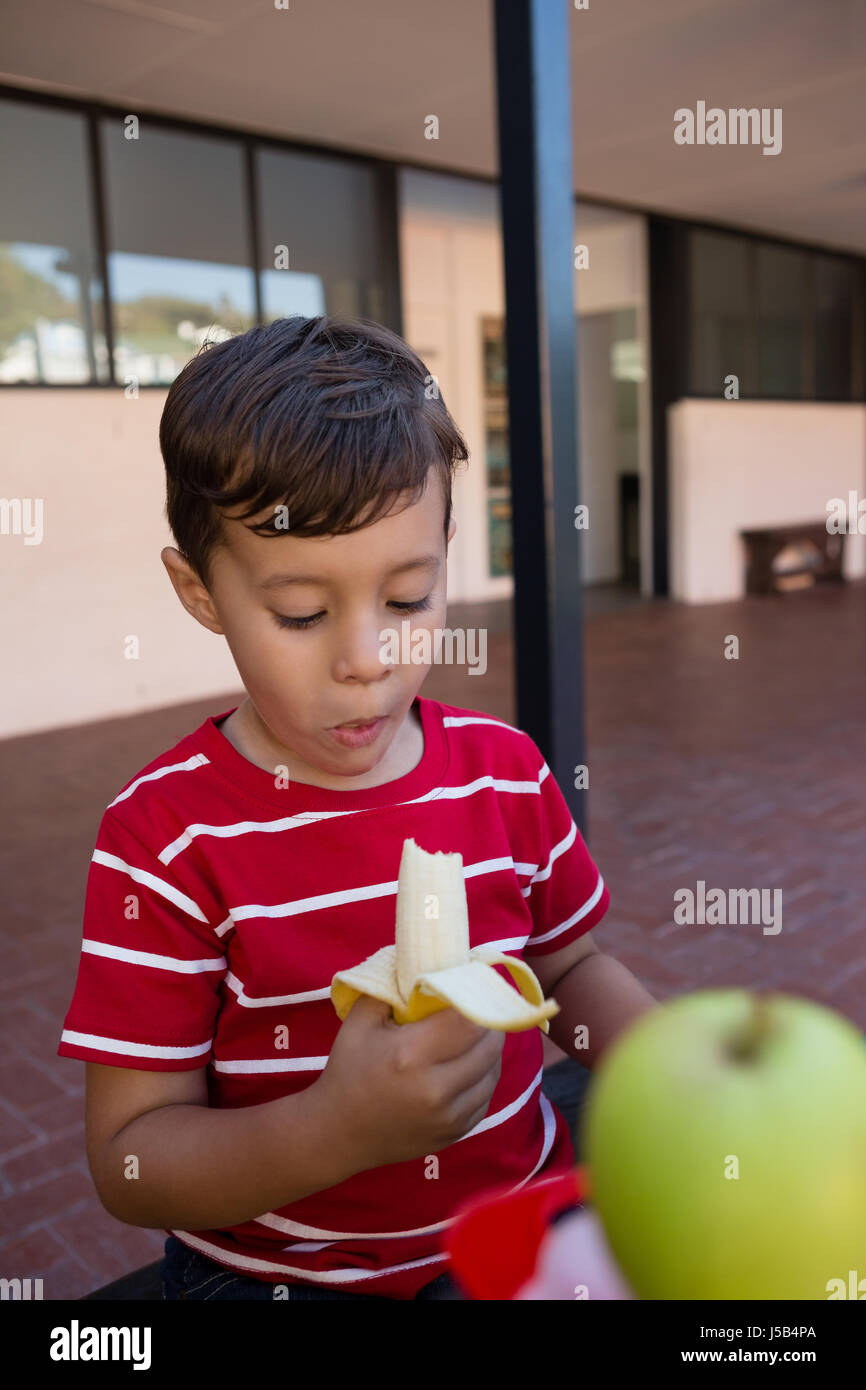Boy eating banana hires stock photography and images Alamy