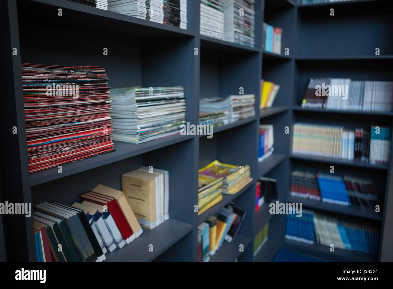 Close up of books arranged on shelves in library Stock Photo Alamy