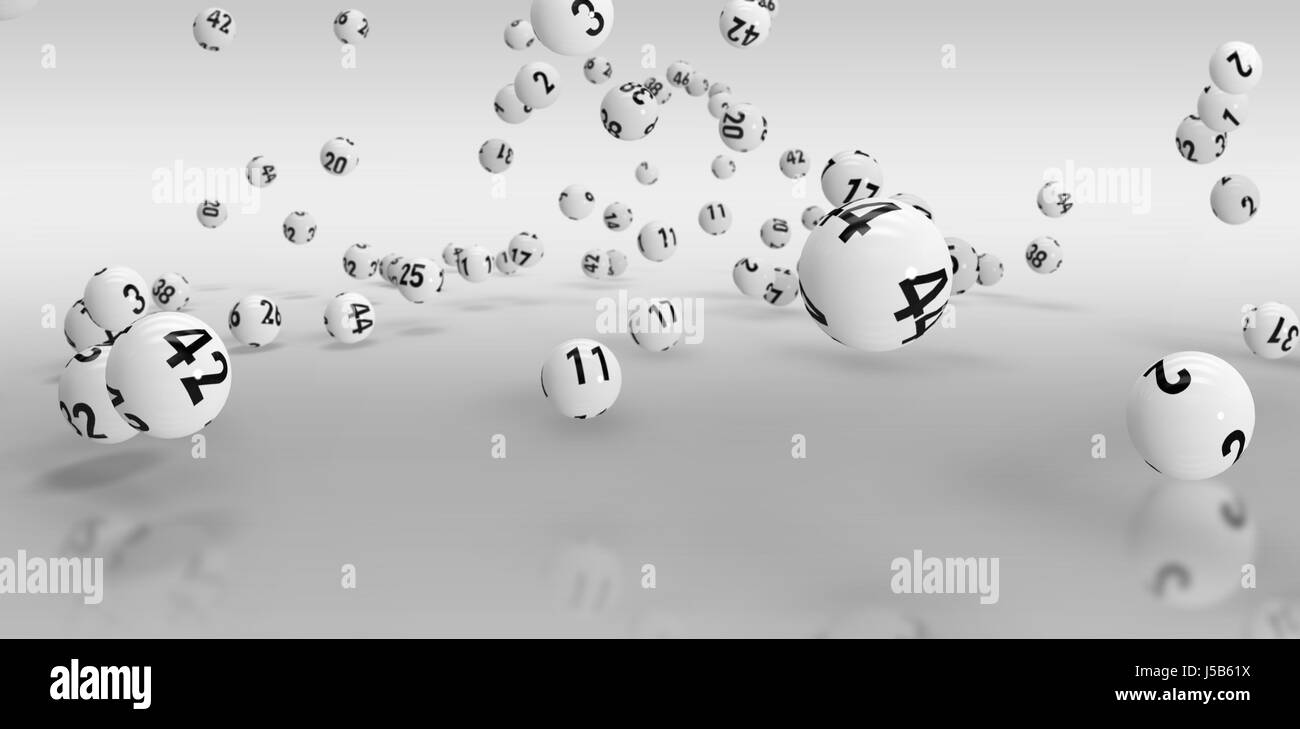 Falling lottery balls  against grey background Stock Photo