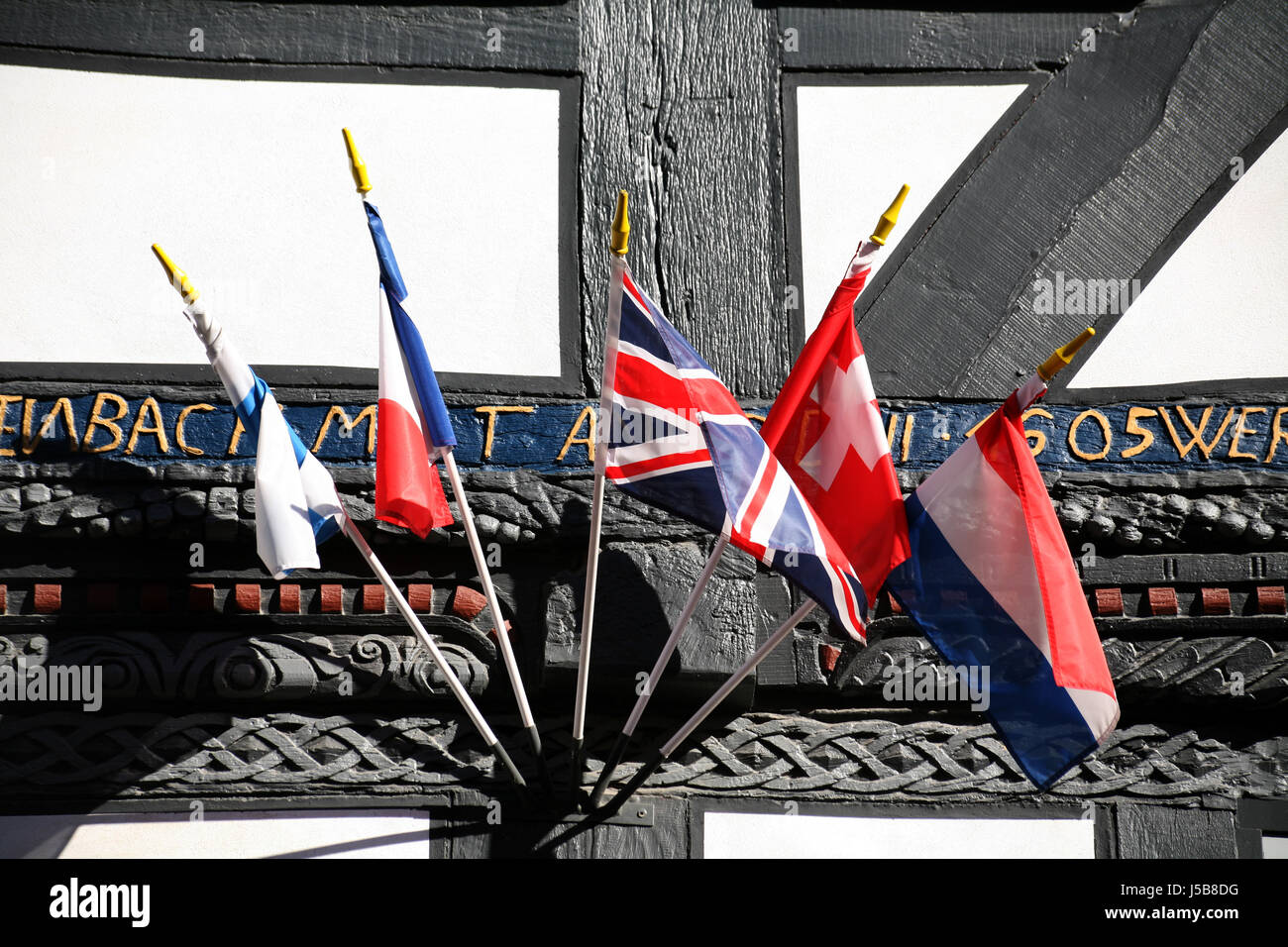 house building frame-work facade flags worldwide international flaggen-parade Stock Photo